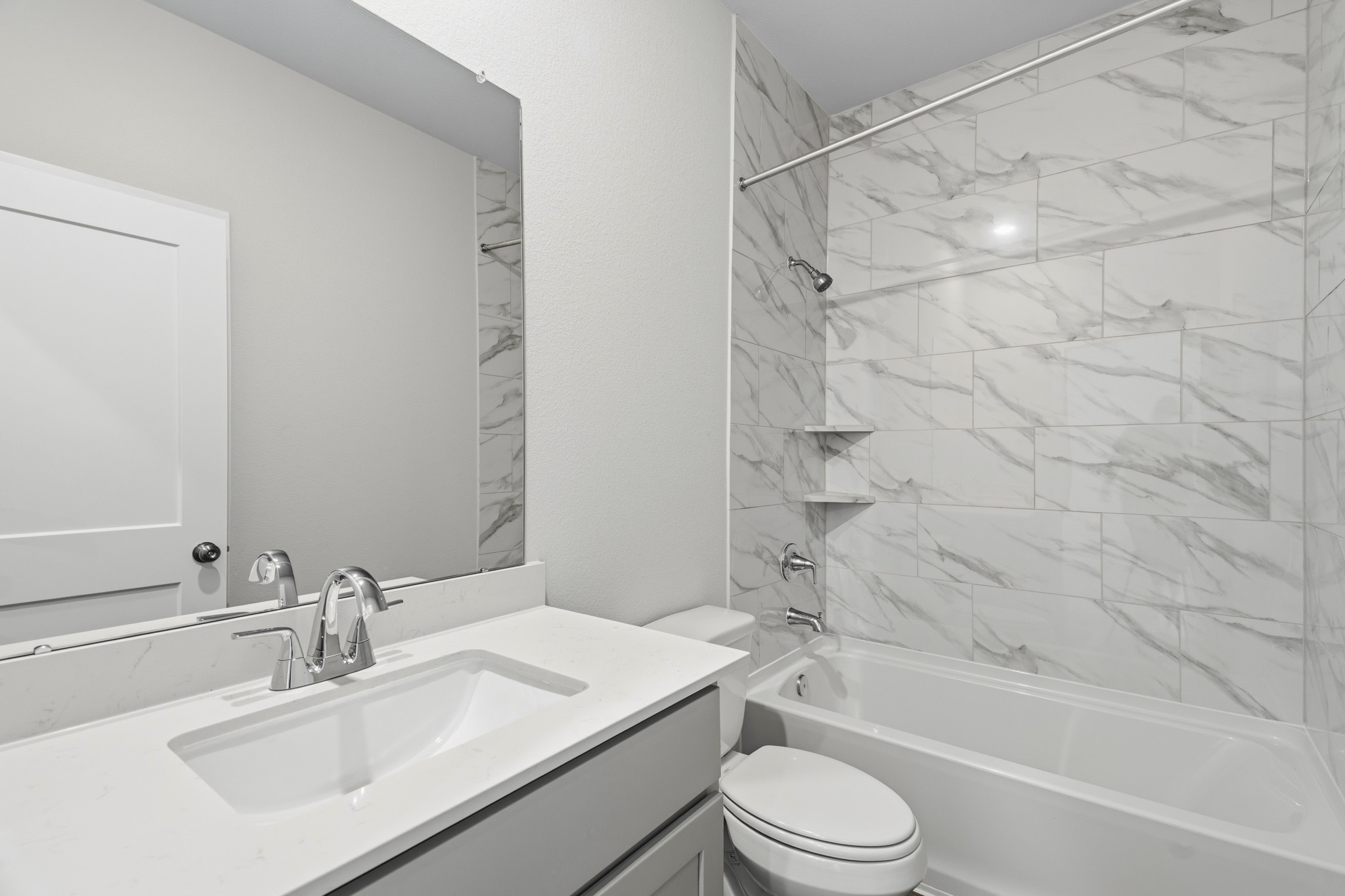 A bathroom with a sink and a bathtub.