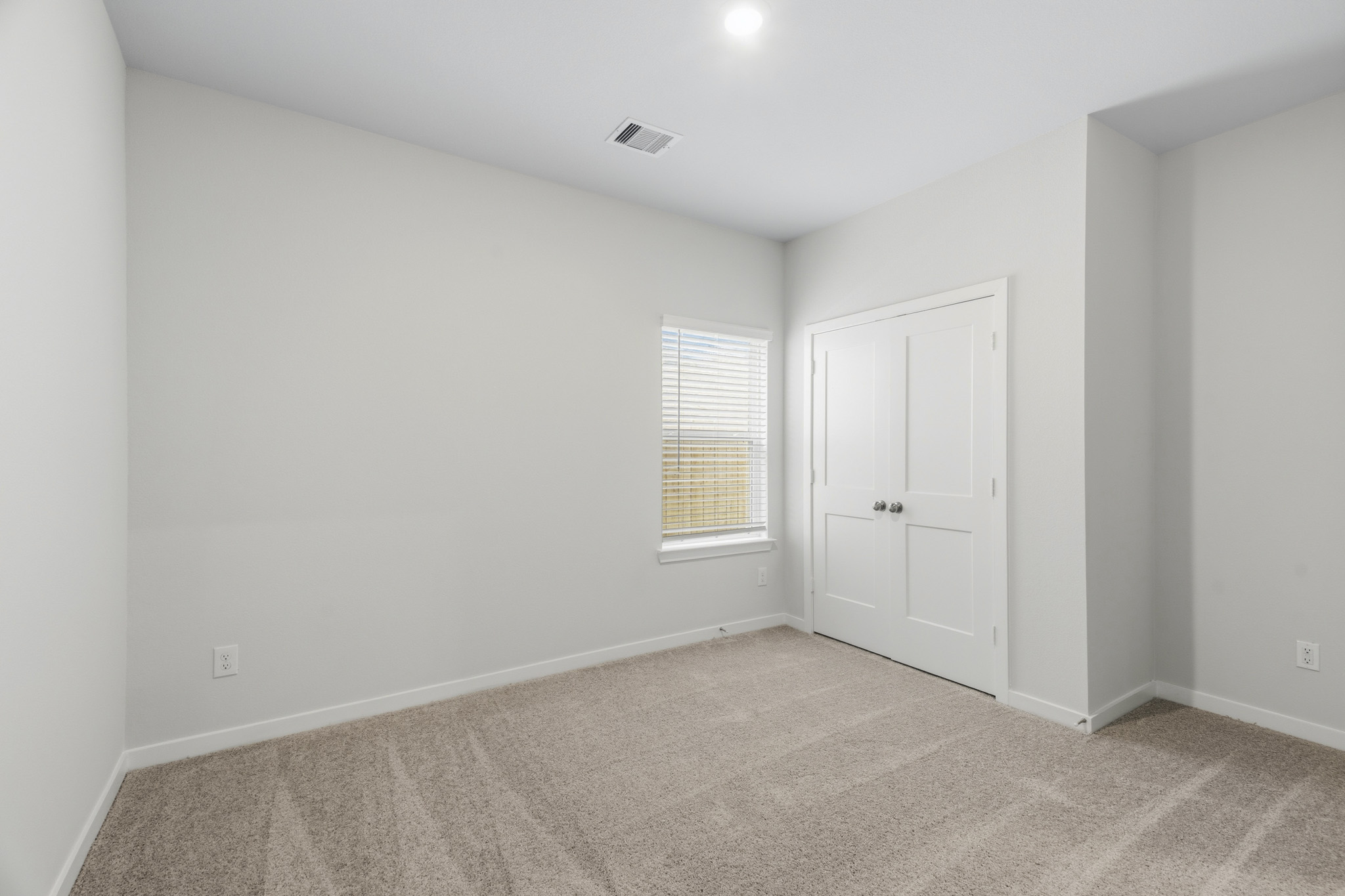 A room with a door and a window.