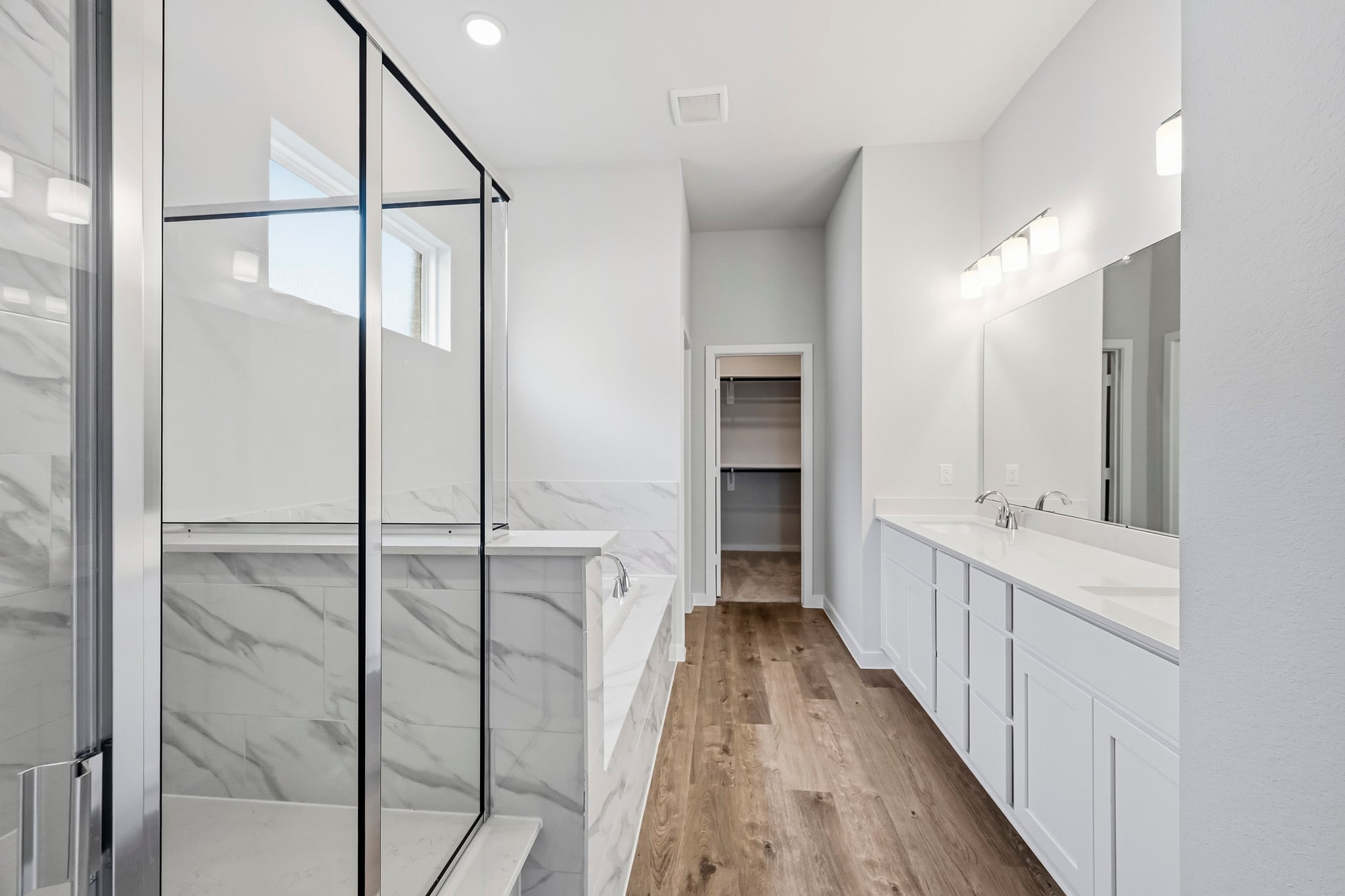 A bathroom with a glass shower.