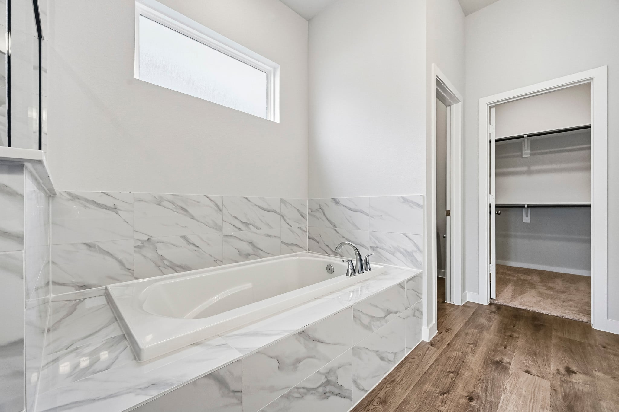 A bathtub in a bathroom.