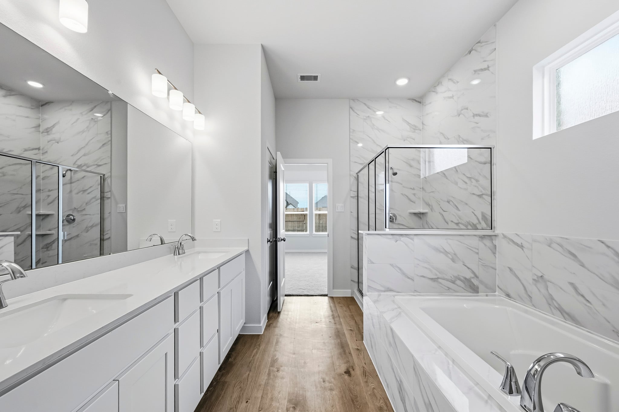 A bathroom with a tub and sink.