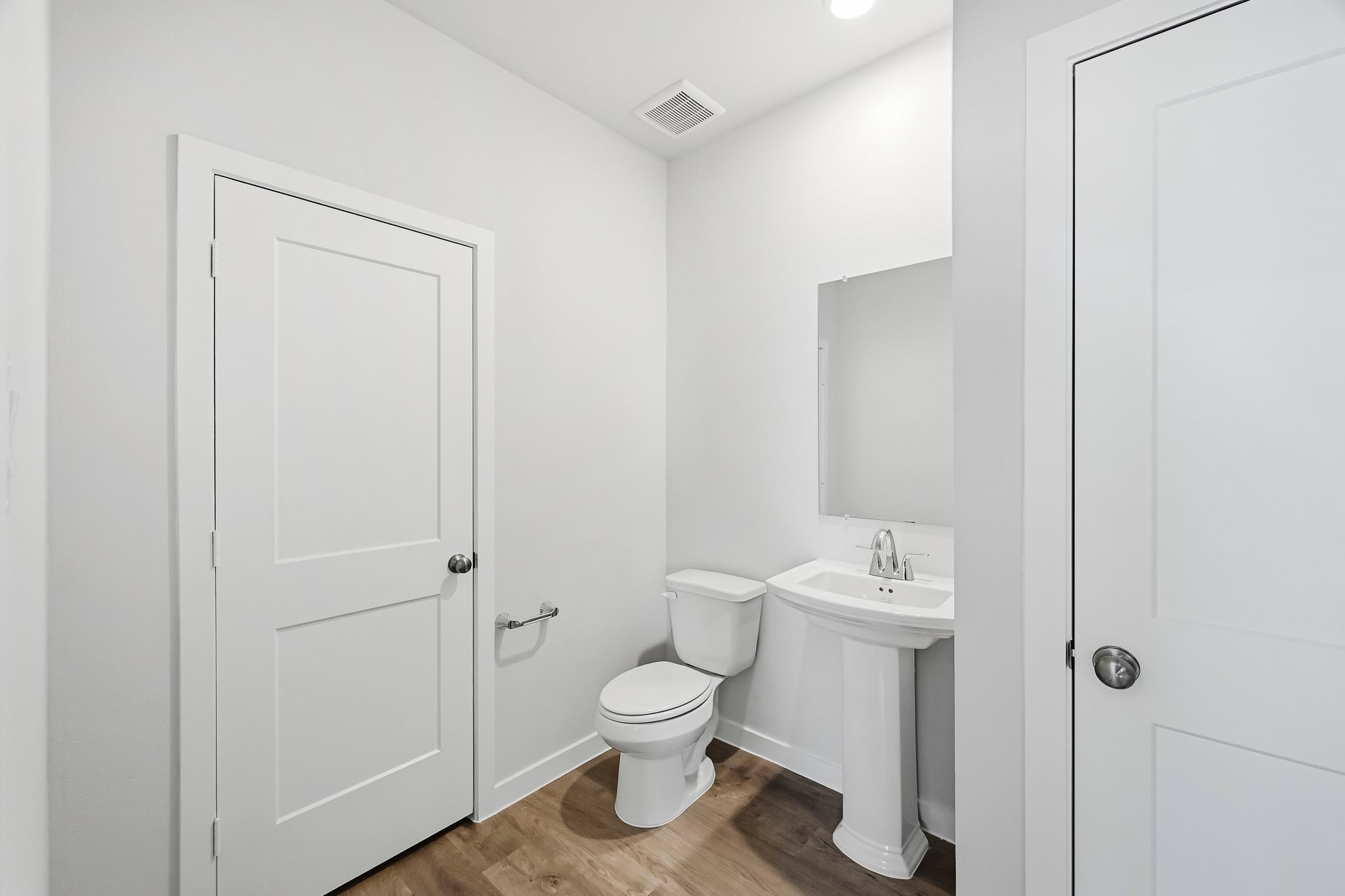A bathroom with a toilet and sink.