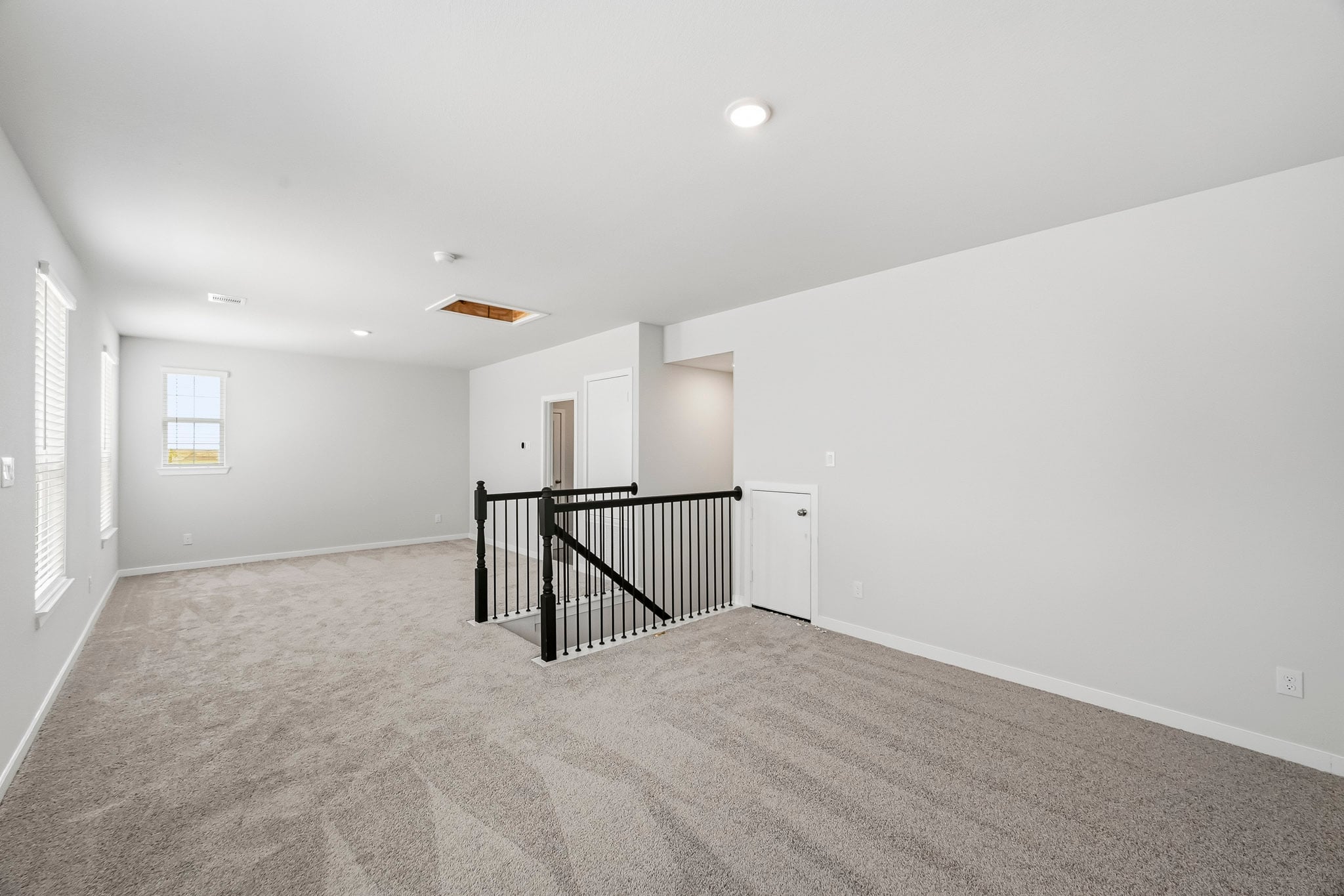 A hallway with a railing.