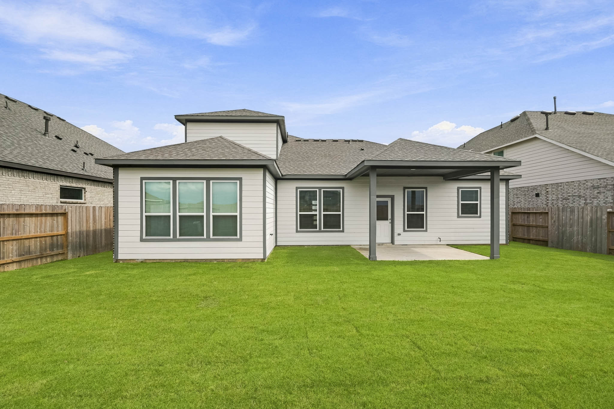 A house with a green lawn.