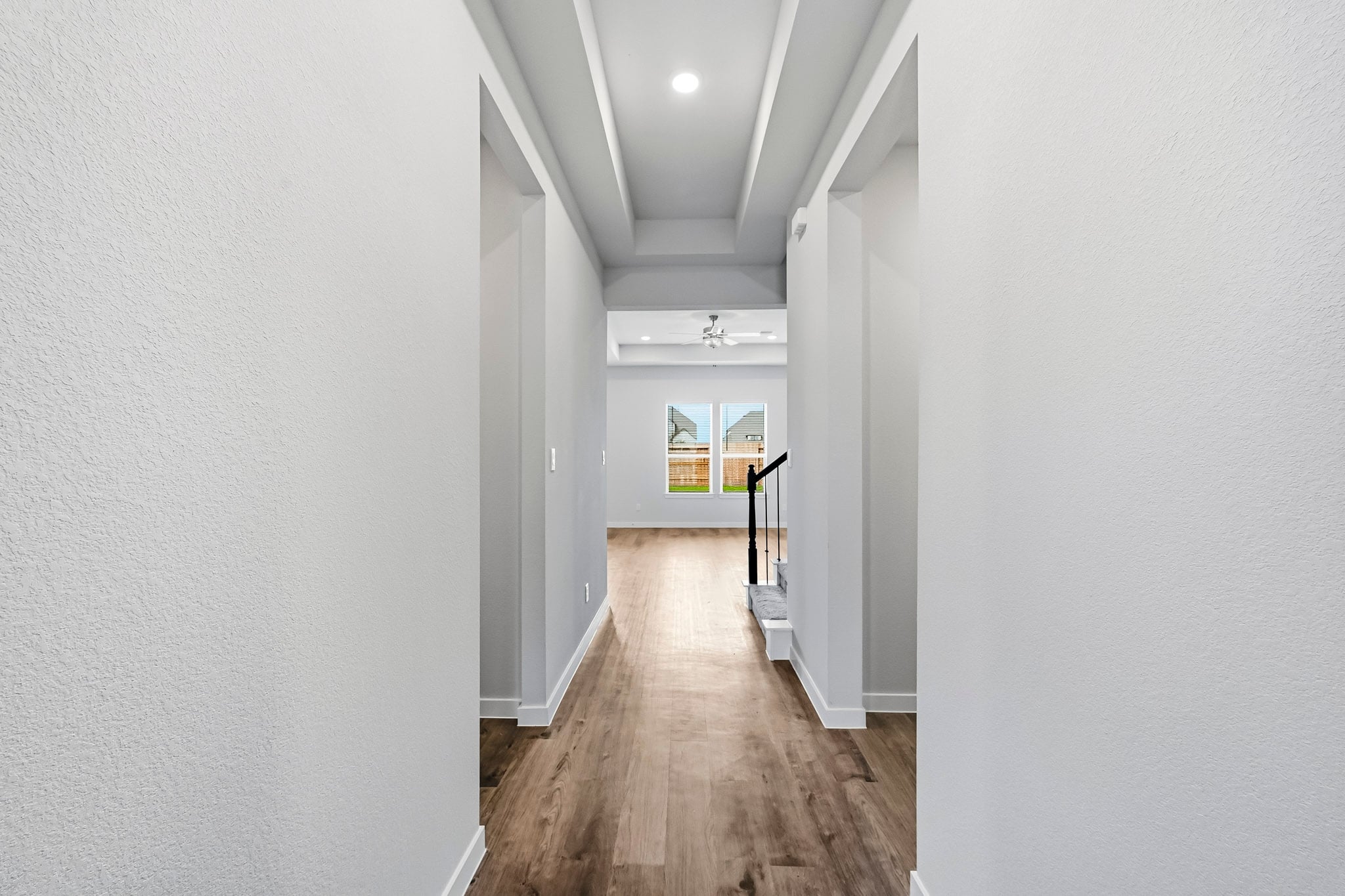 A hallway with white walls.