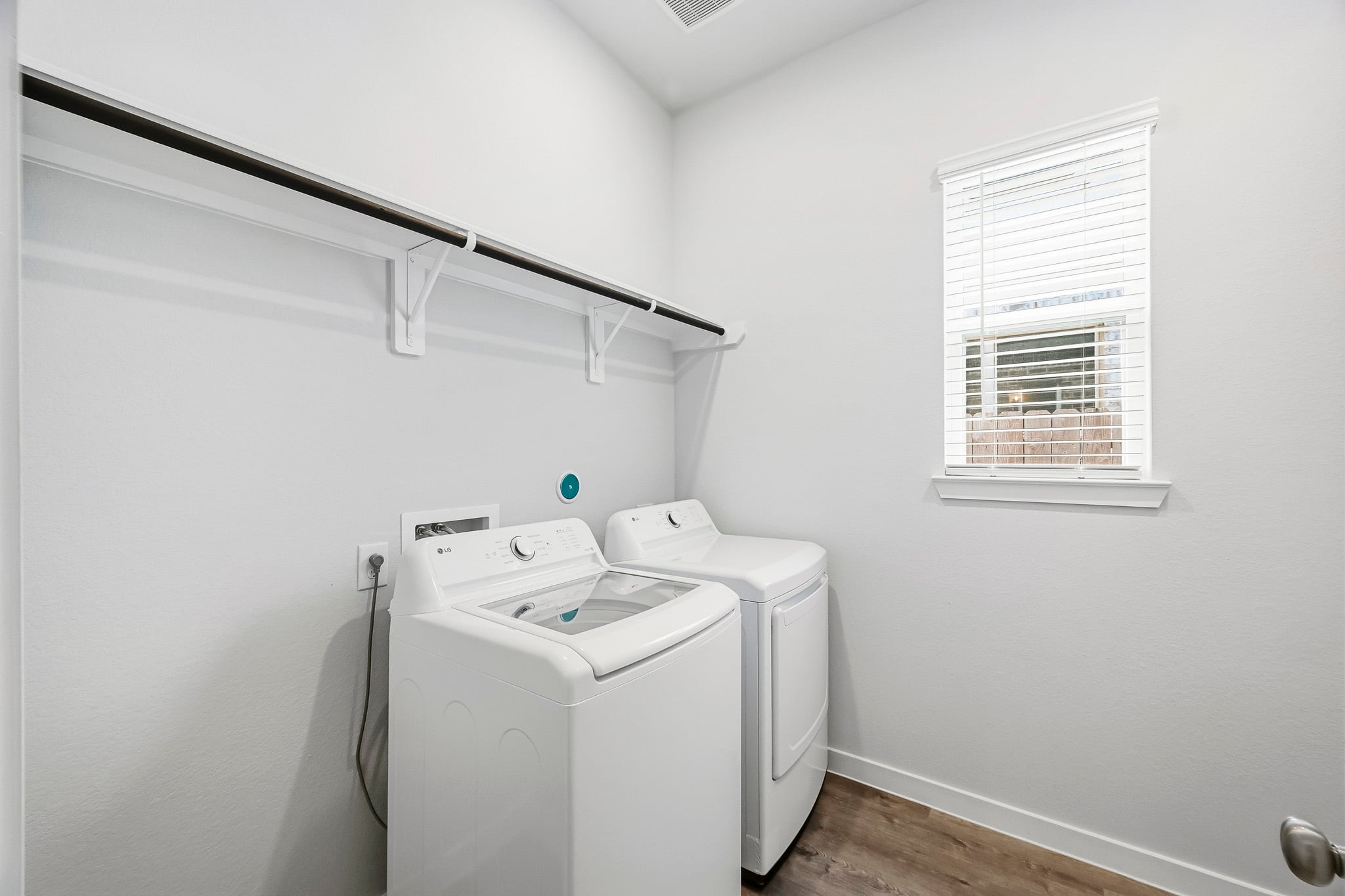 A laundry room with a washer and dryer.