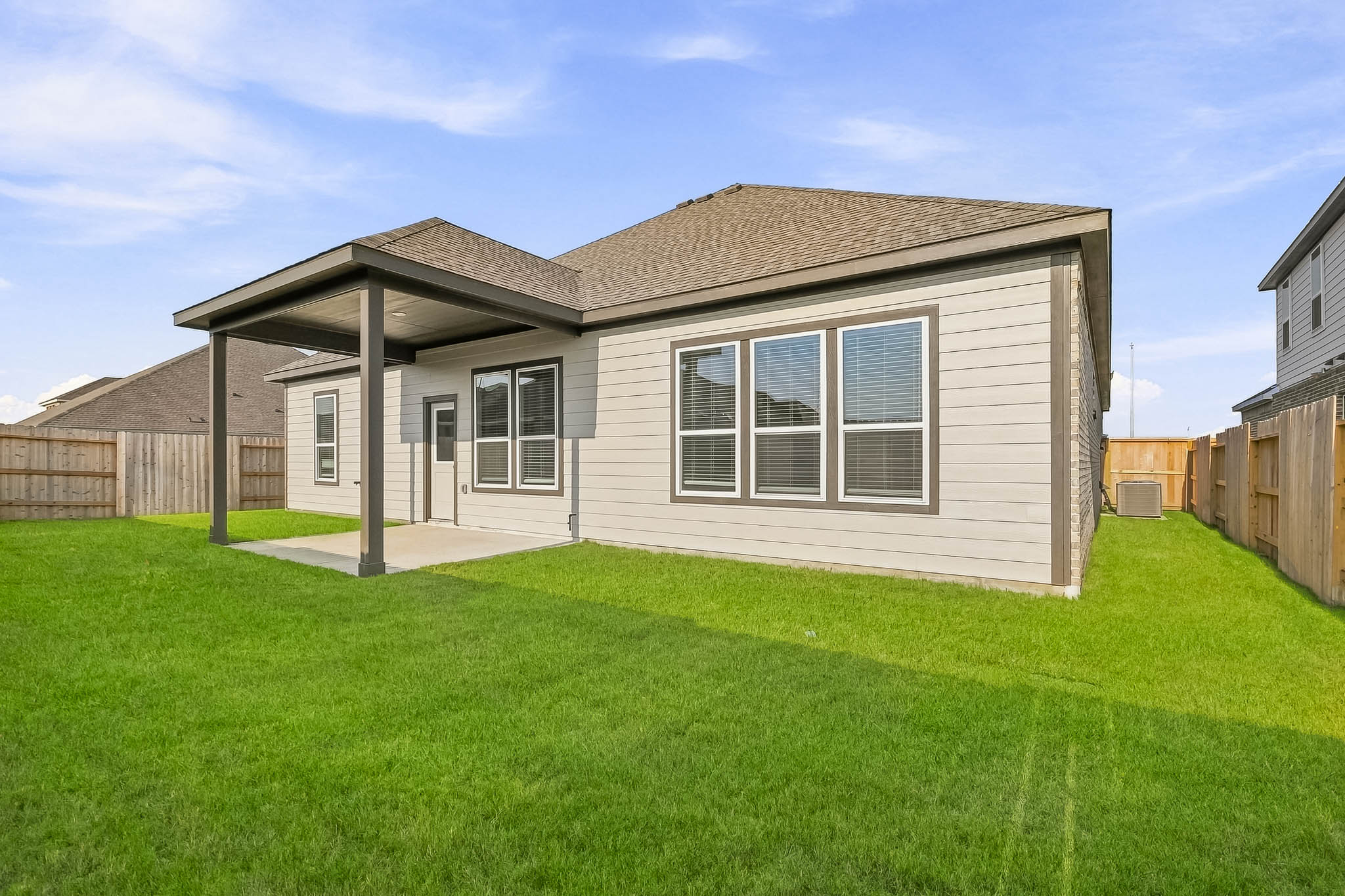 A house with a grass yard.