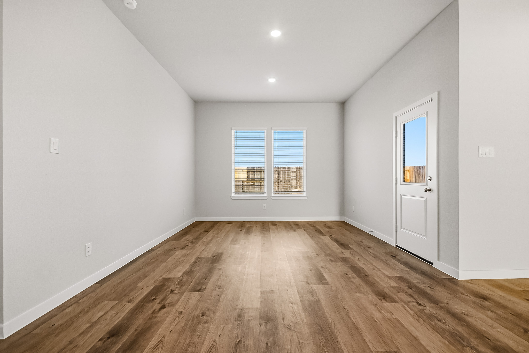 A room with a wood floor and a wood floor.
