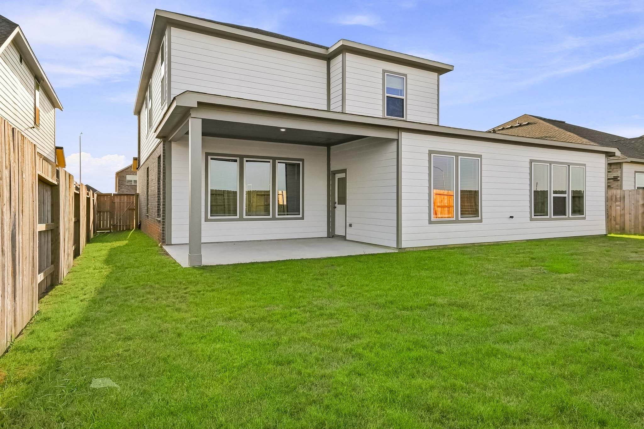 A house with a green lawn.