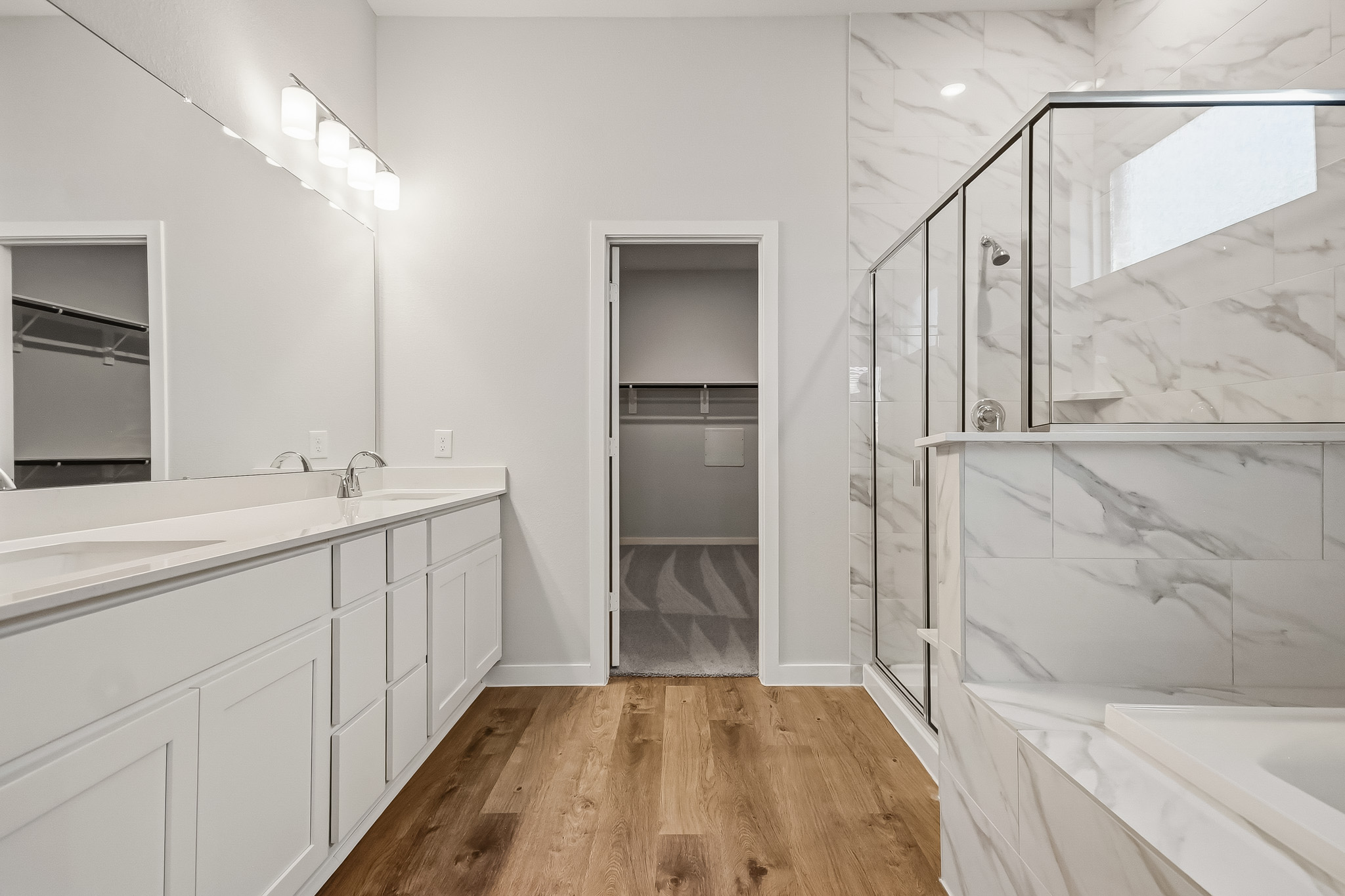 A bathroom with a glass shower.