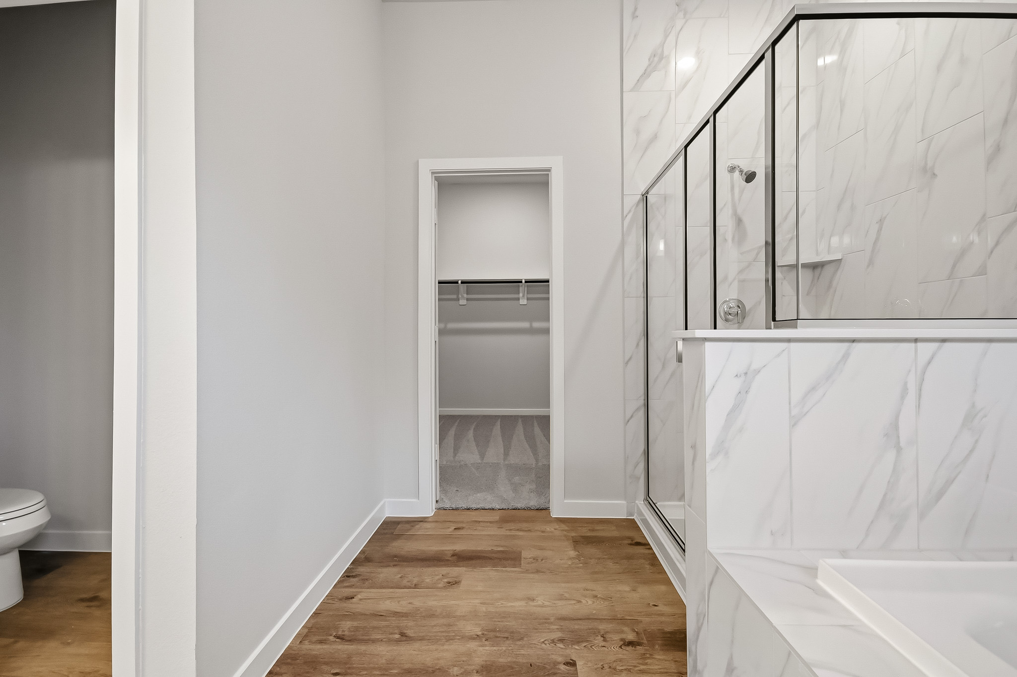 A bathroom with a glass shower.