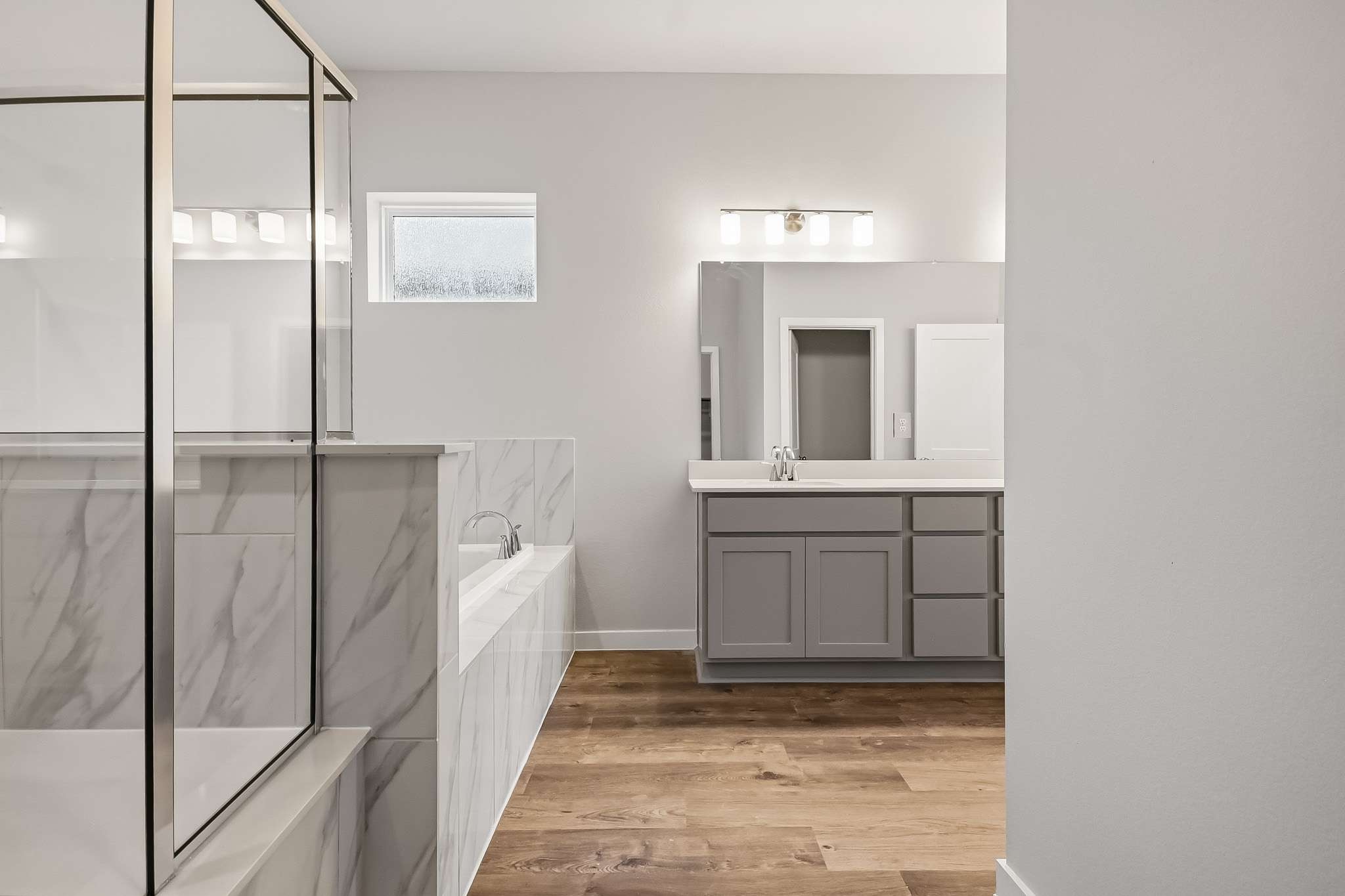 A bathroom with a glass shower.