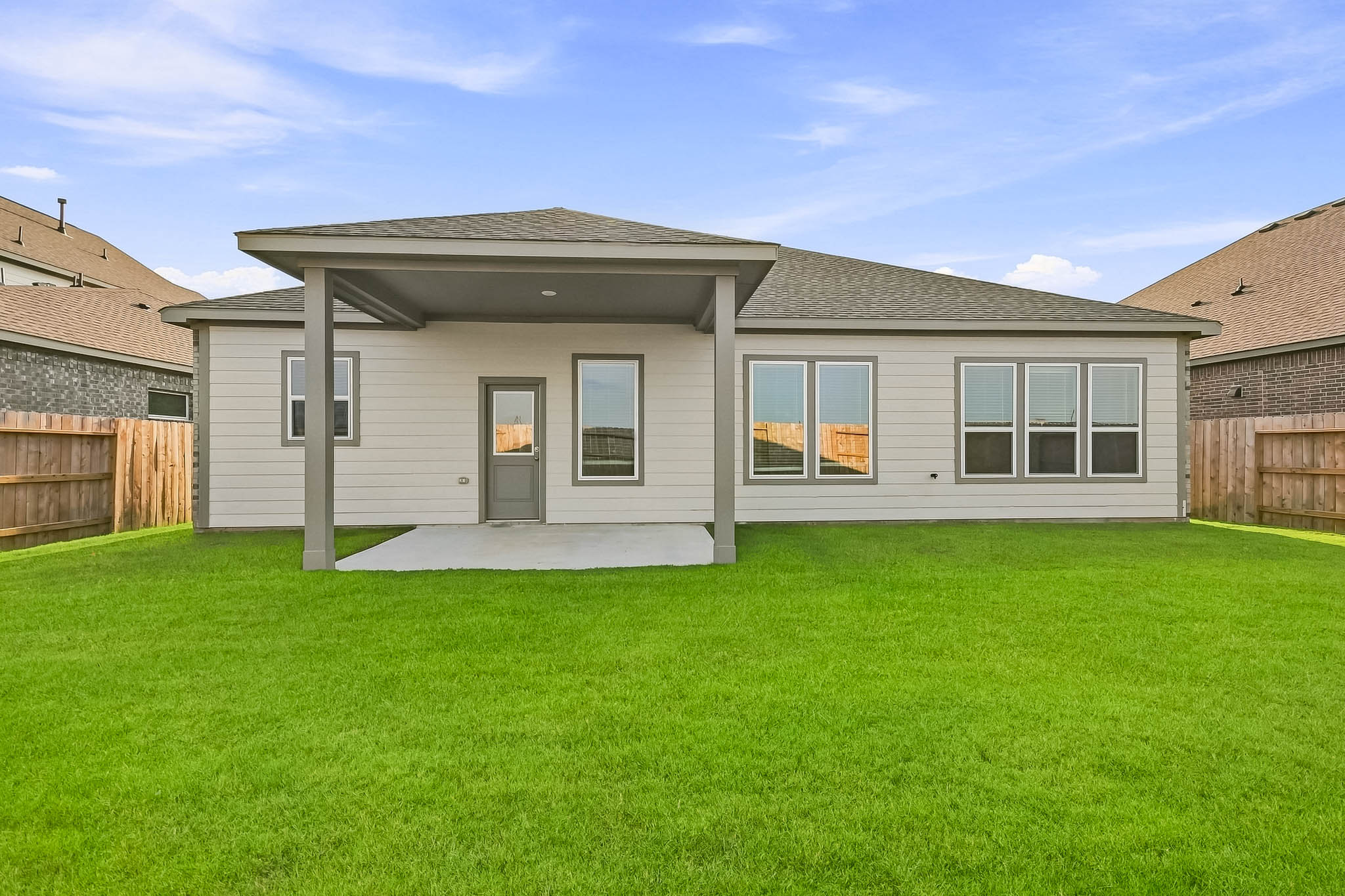 A house with a green lawn.