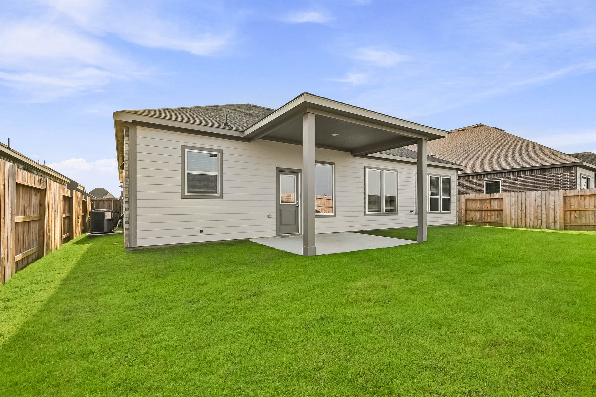 A house with a grass yard.
