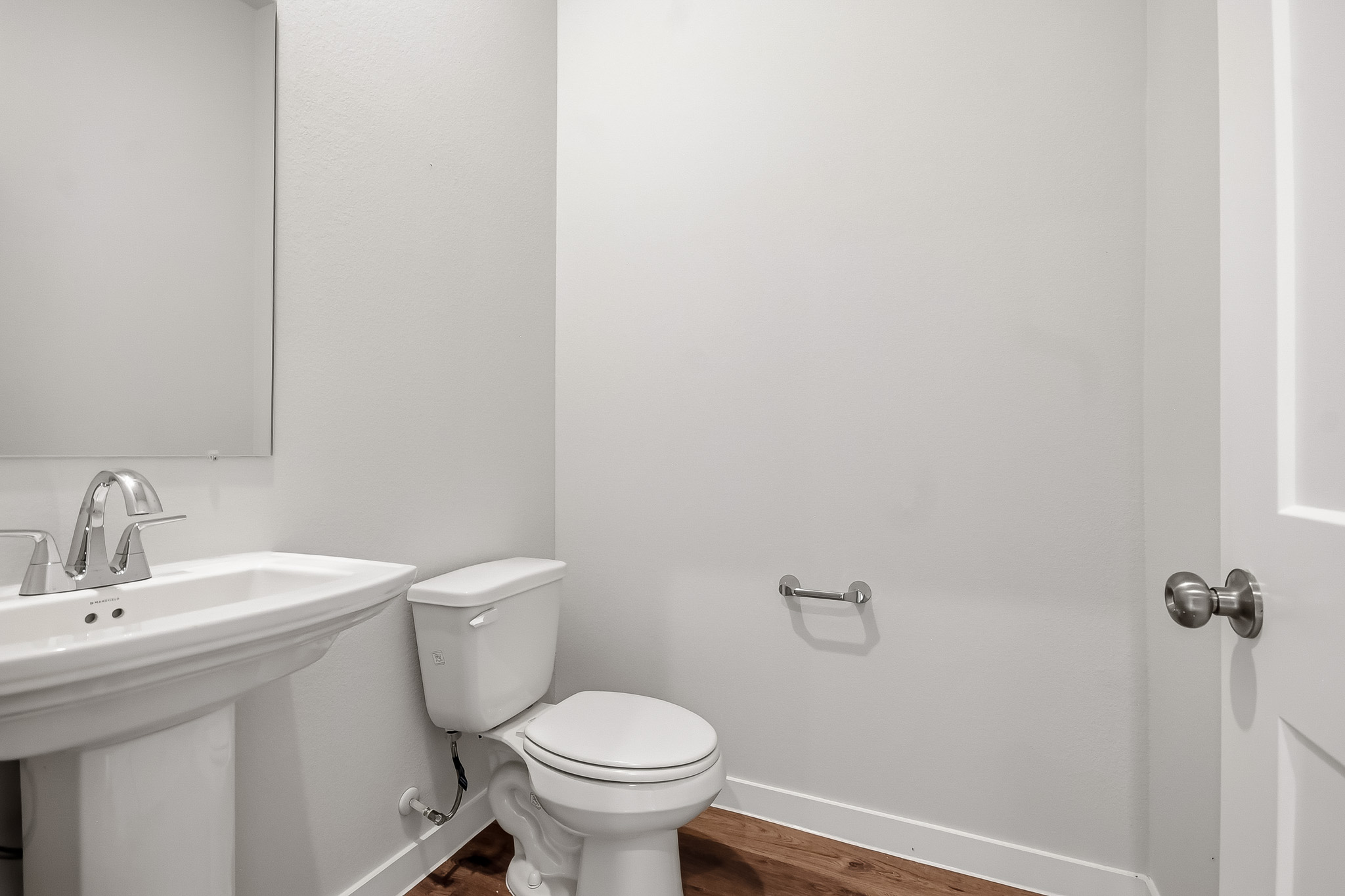 A bathroom with a toilet and sink.