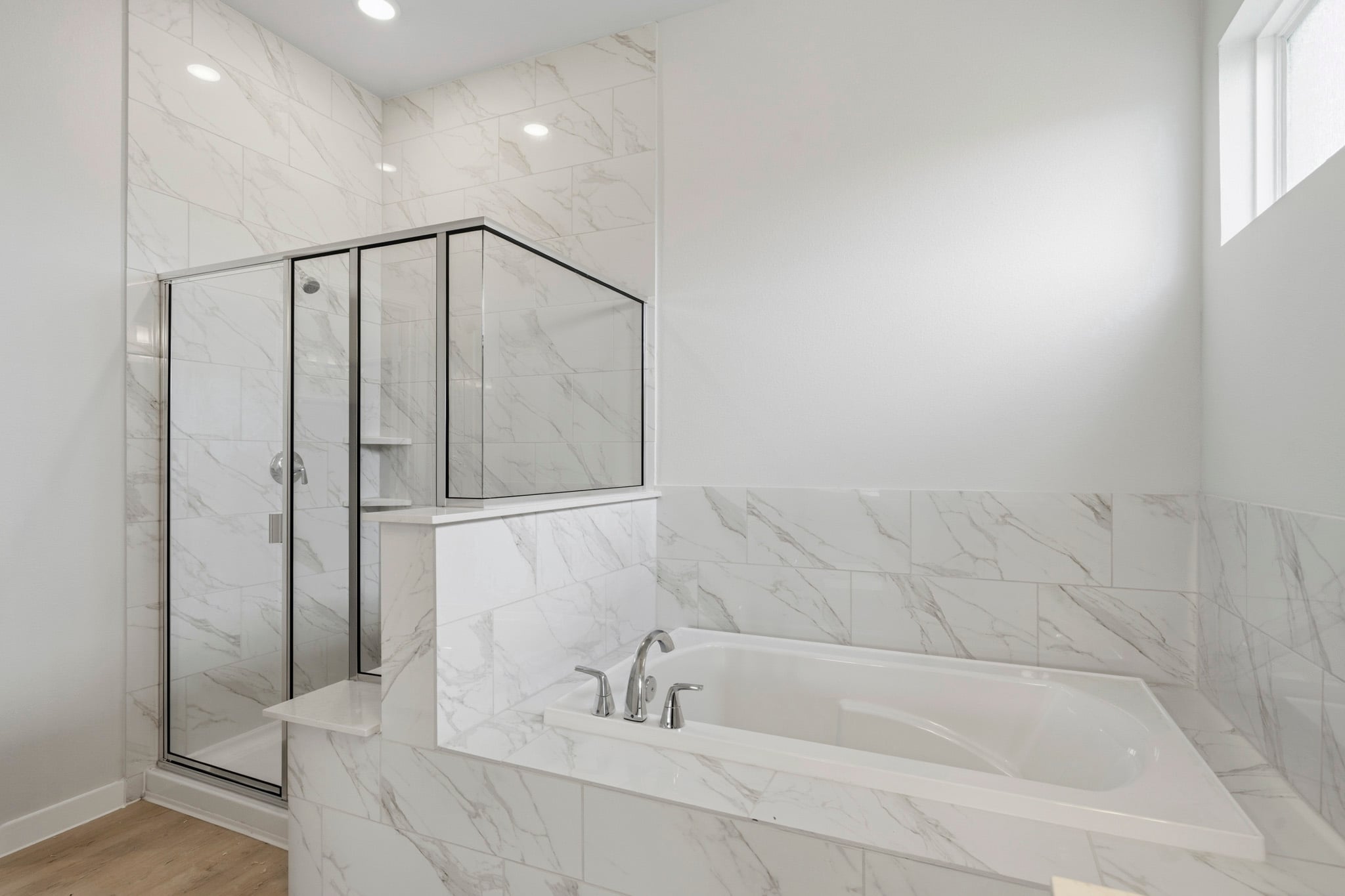 A bathroom with a glass shower.