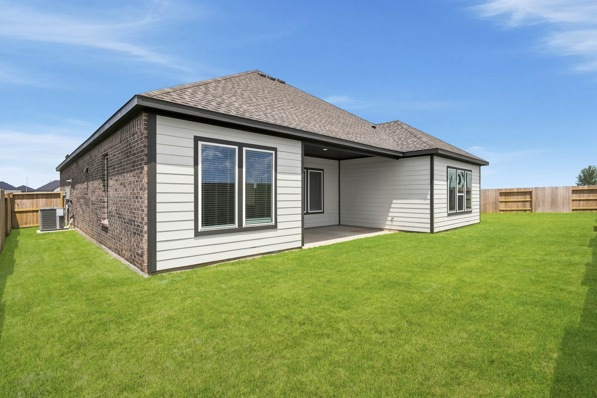 A house with a grass yard.