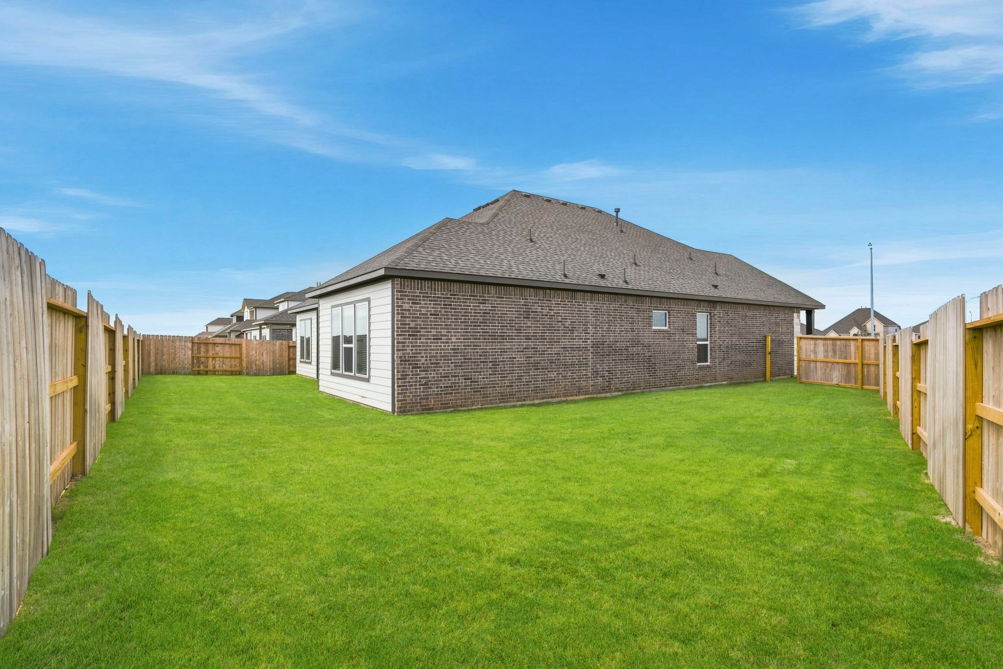 A house in a grassy field.