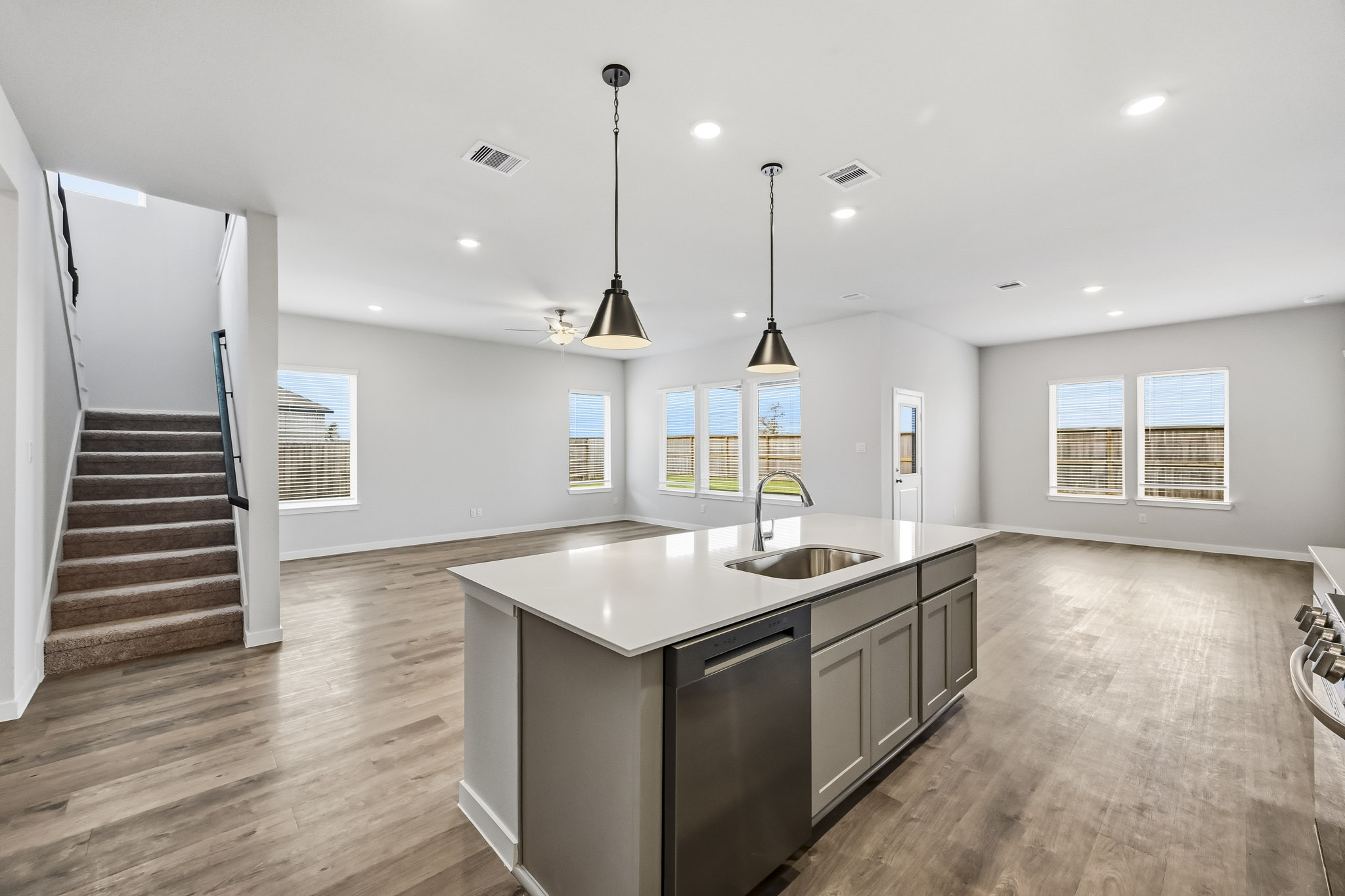 A kitchen with a wood floor.