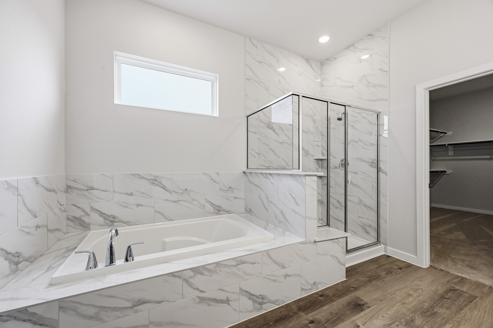 A bathroom with a glass shower.