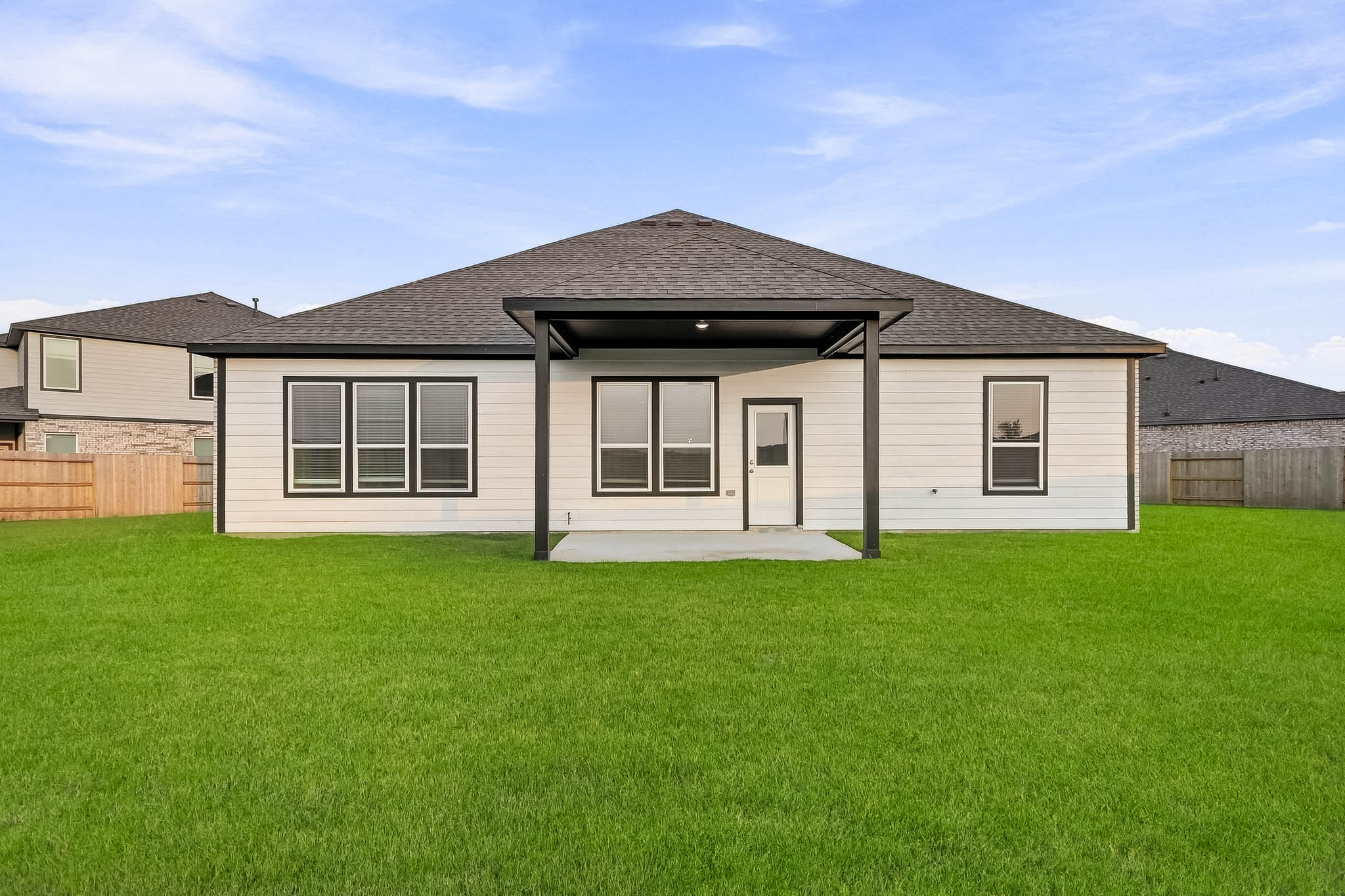A house with a grass yard.