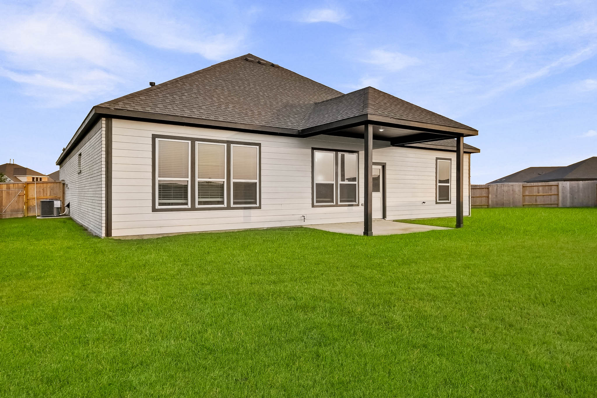 A house with a grass yard.
