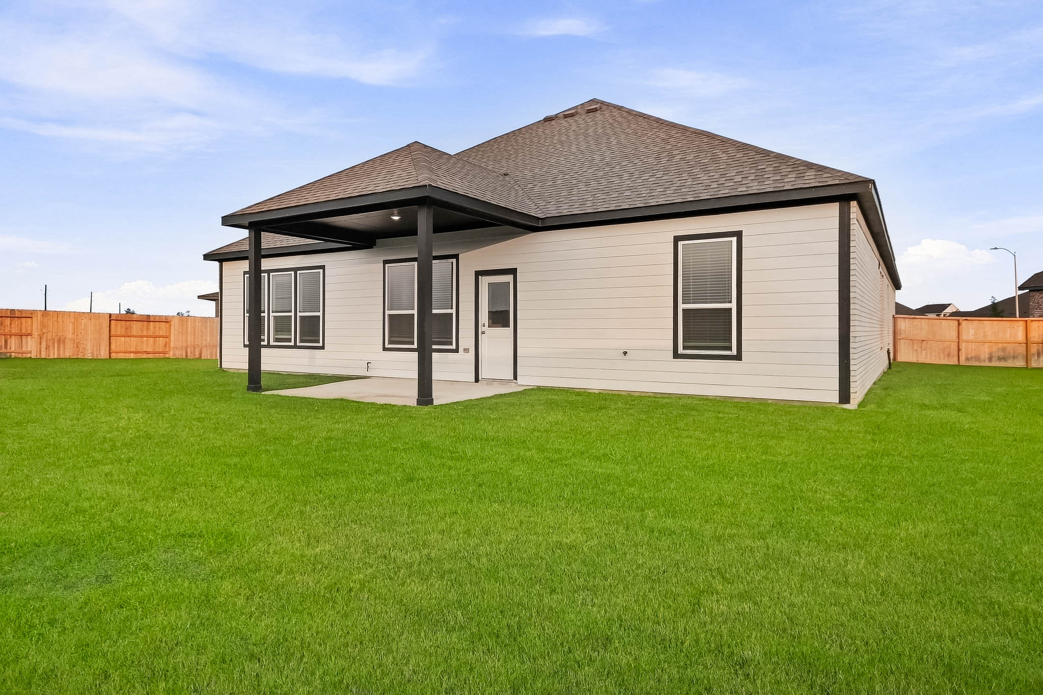 A house with a grass yard.