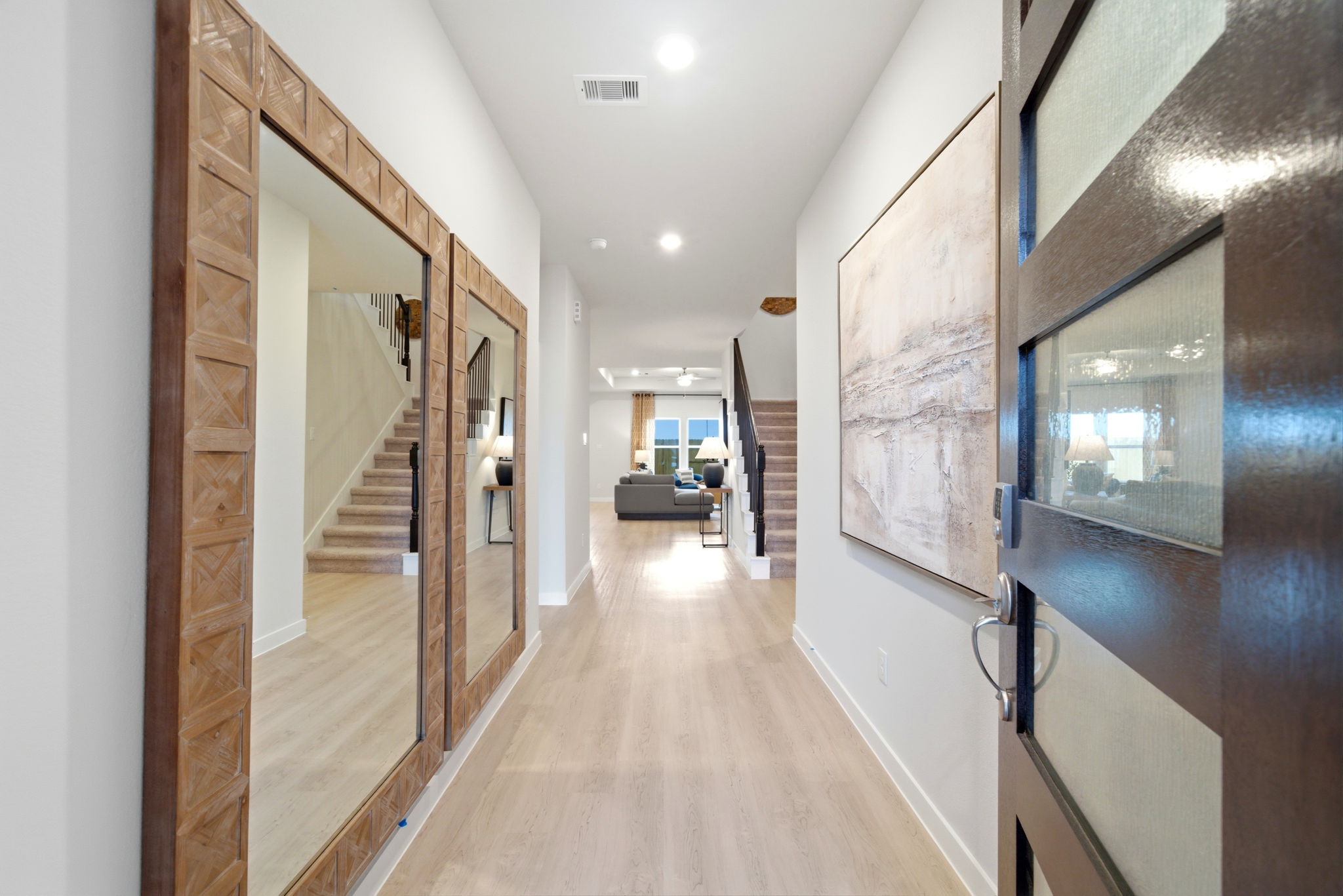 A hallway with glass doors.