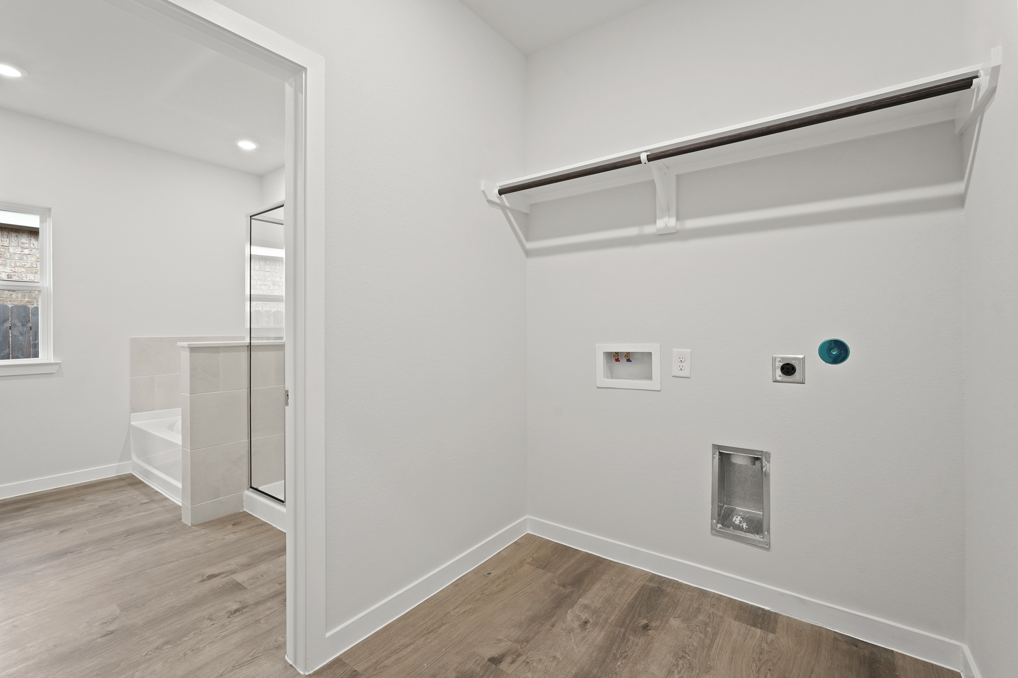 A room with a glass shower.