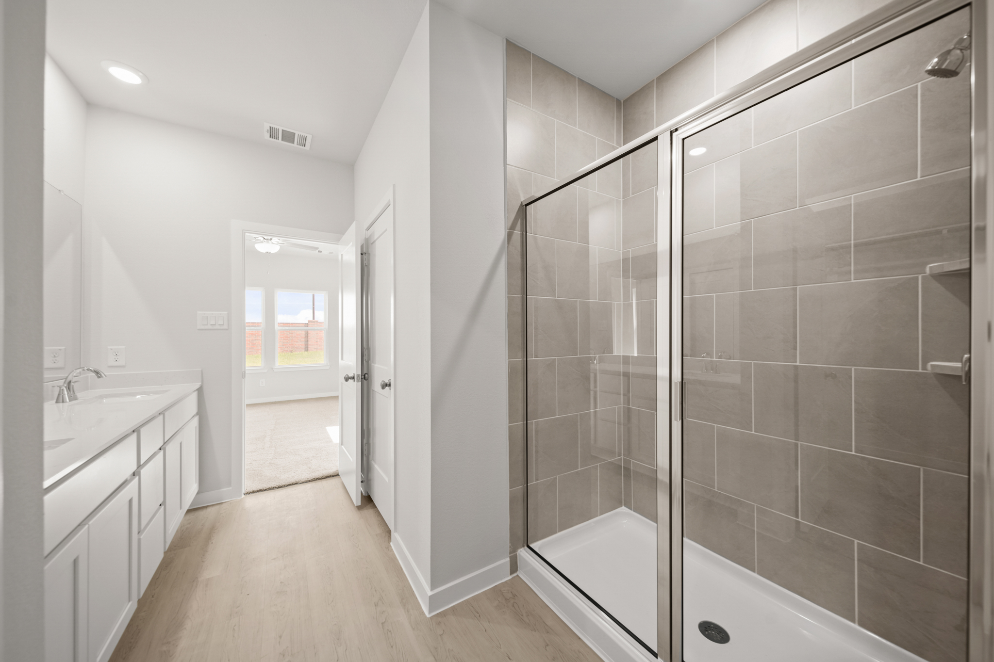 A bathroom with a glass shower.