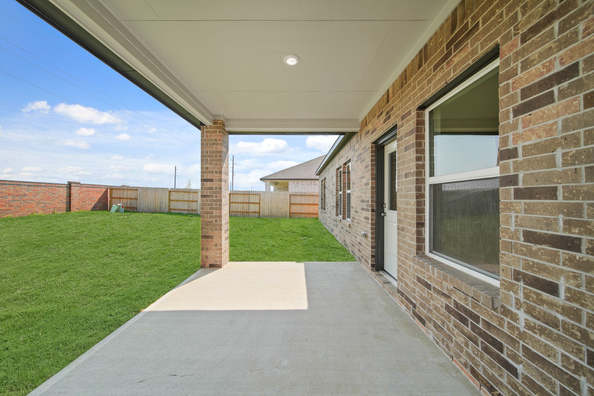 A brick building with a brick walkway.
