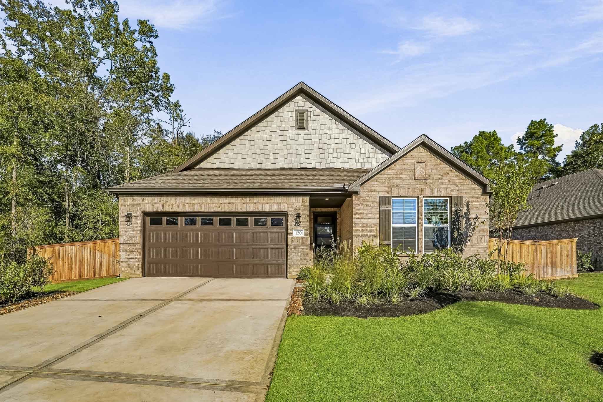 A house with a garage and a driveway.