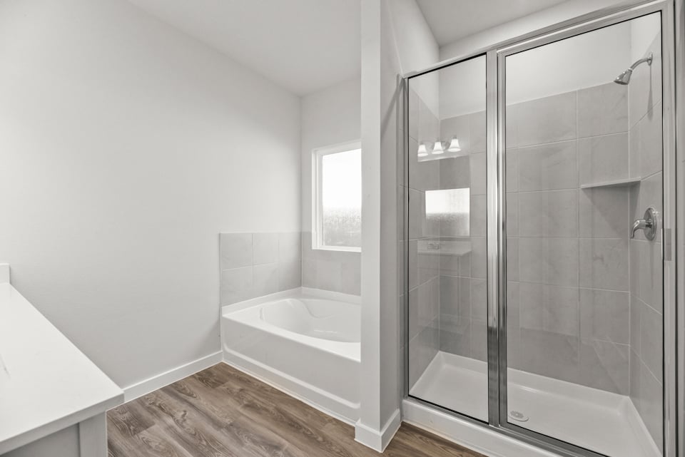 A bathroom with a glass shower.