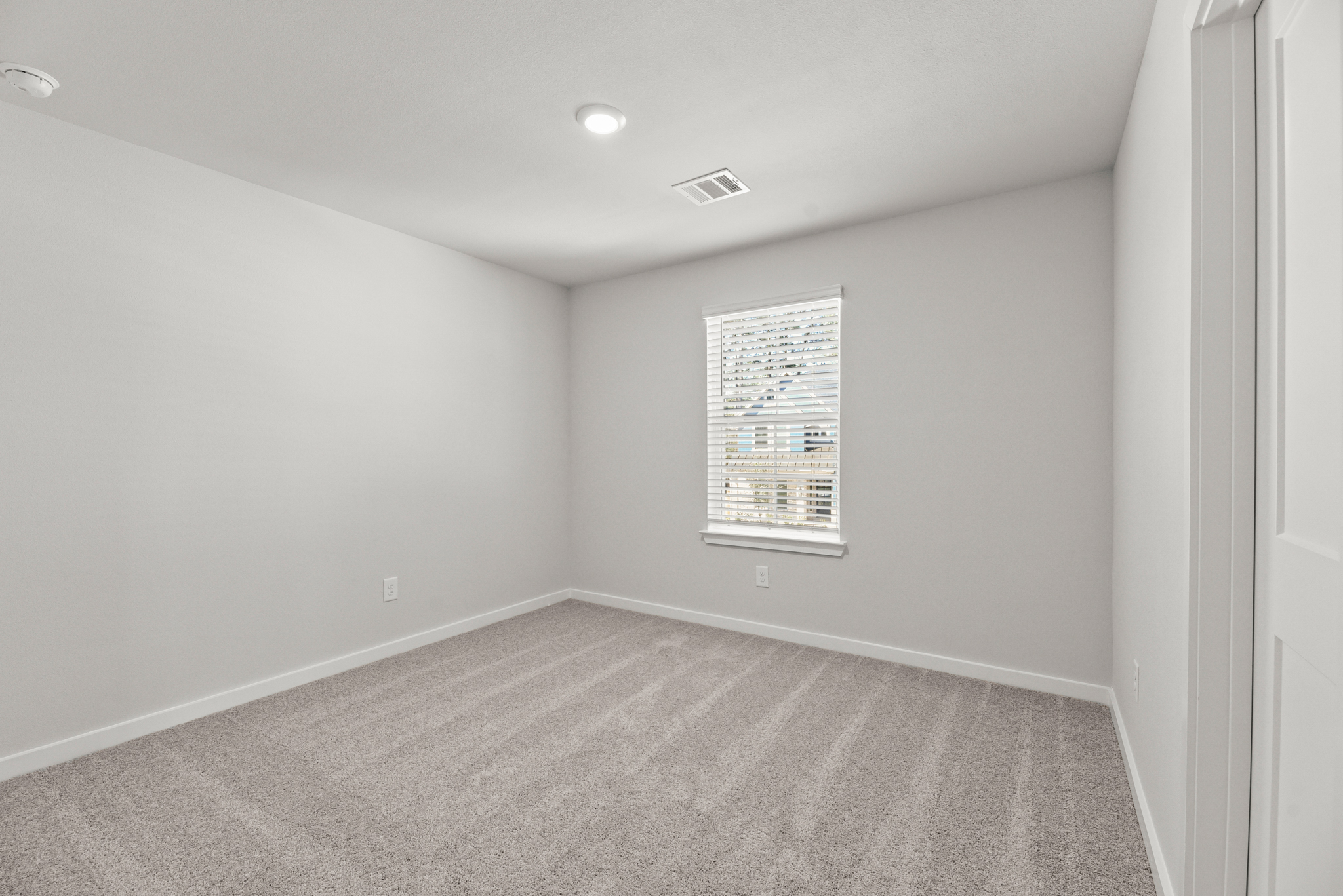 A room with a sign on the wall.