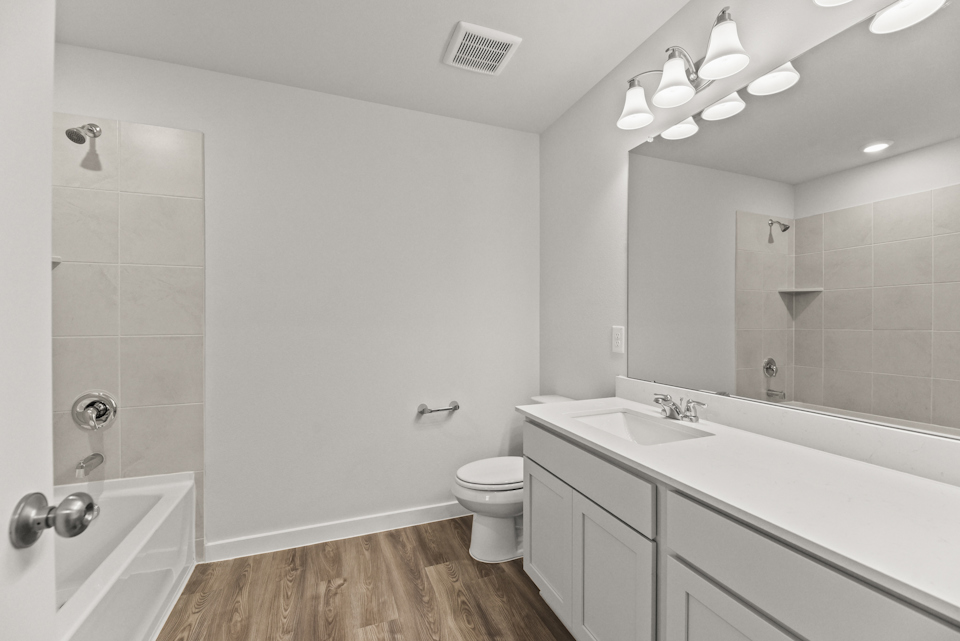 A bathroom with a glass shower.