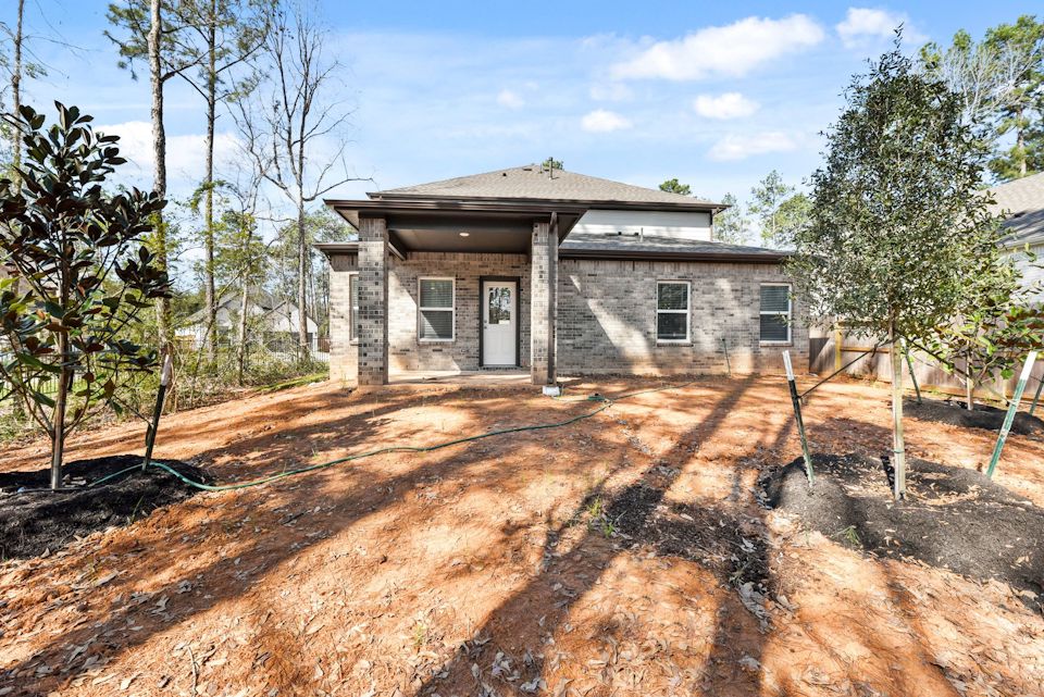 A house with trees around it.