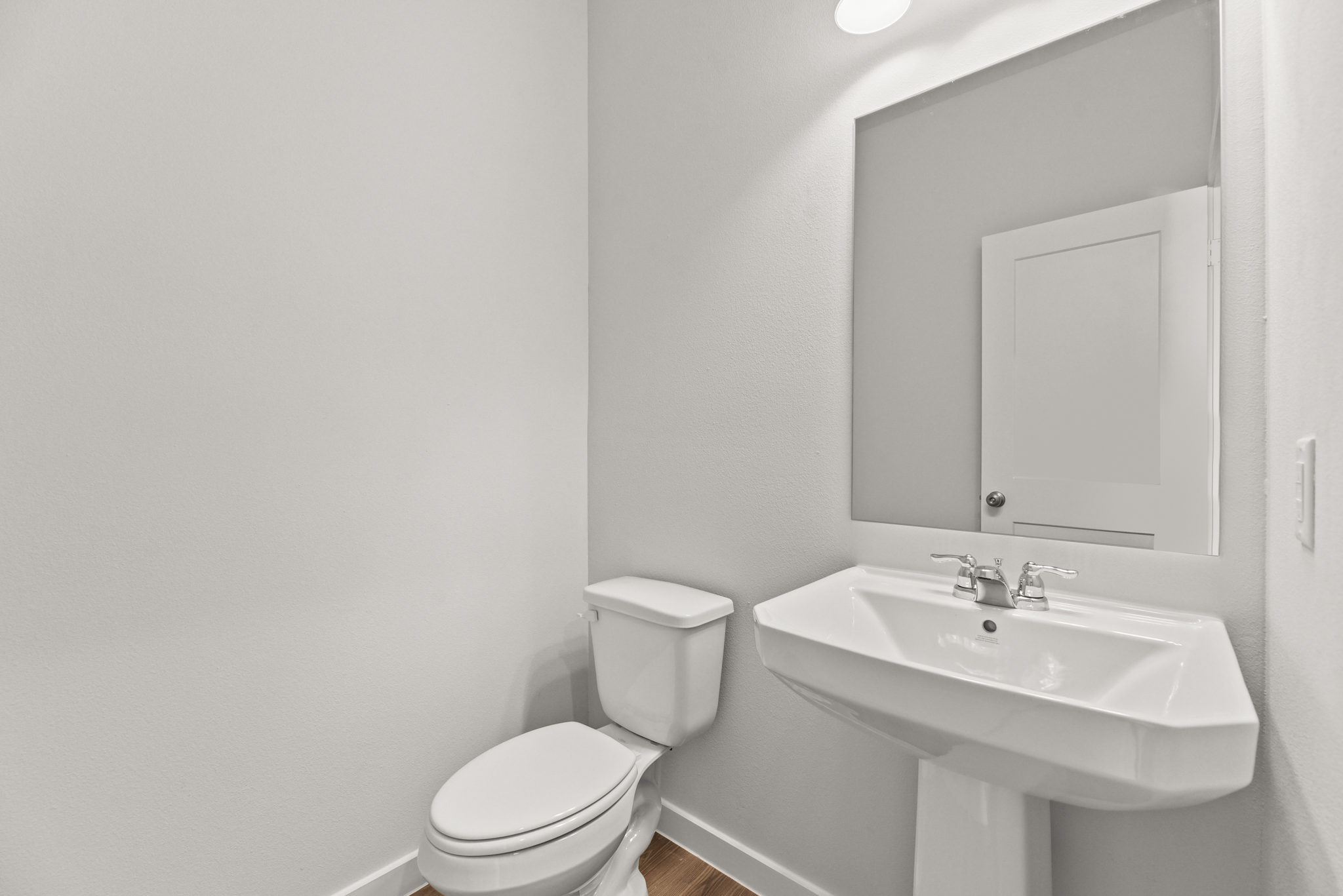 A bathroom with a sink and toilet.