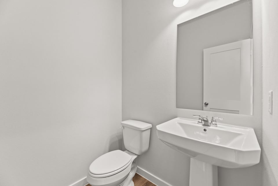 A bathroom with a sink and toilet.