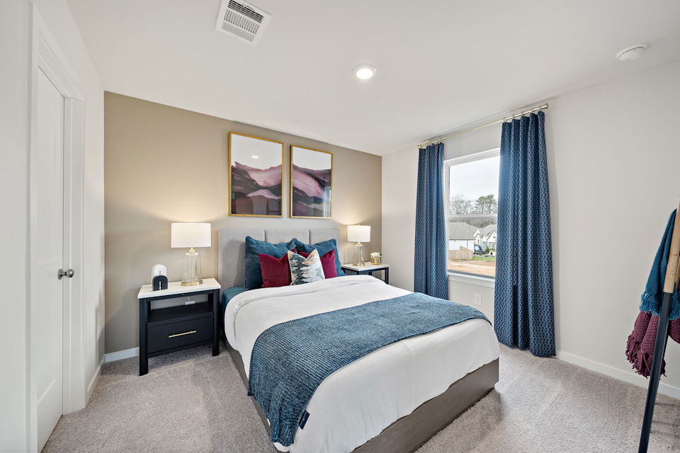 A bedroom with a large bed.