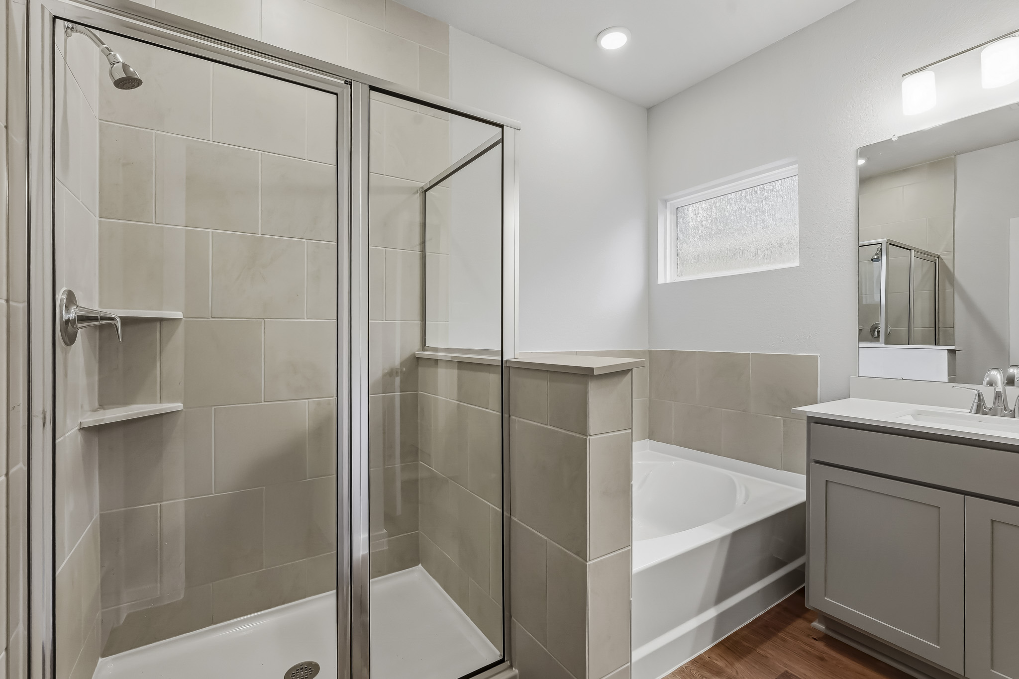 A bathroom with a glass shower.