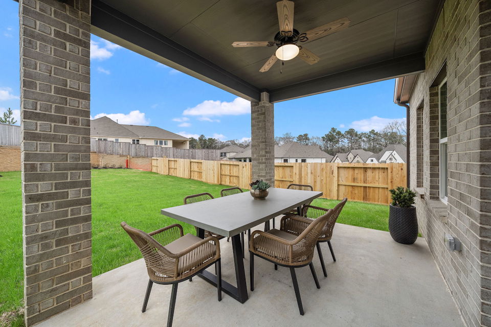 A patio with a table and chairs.