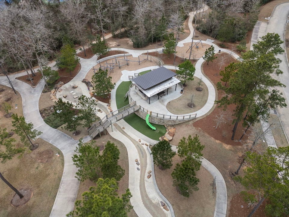 A building with a courtyard and trees around it.