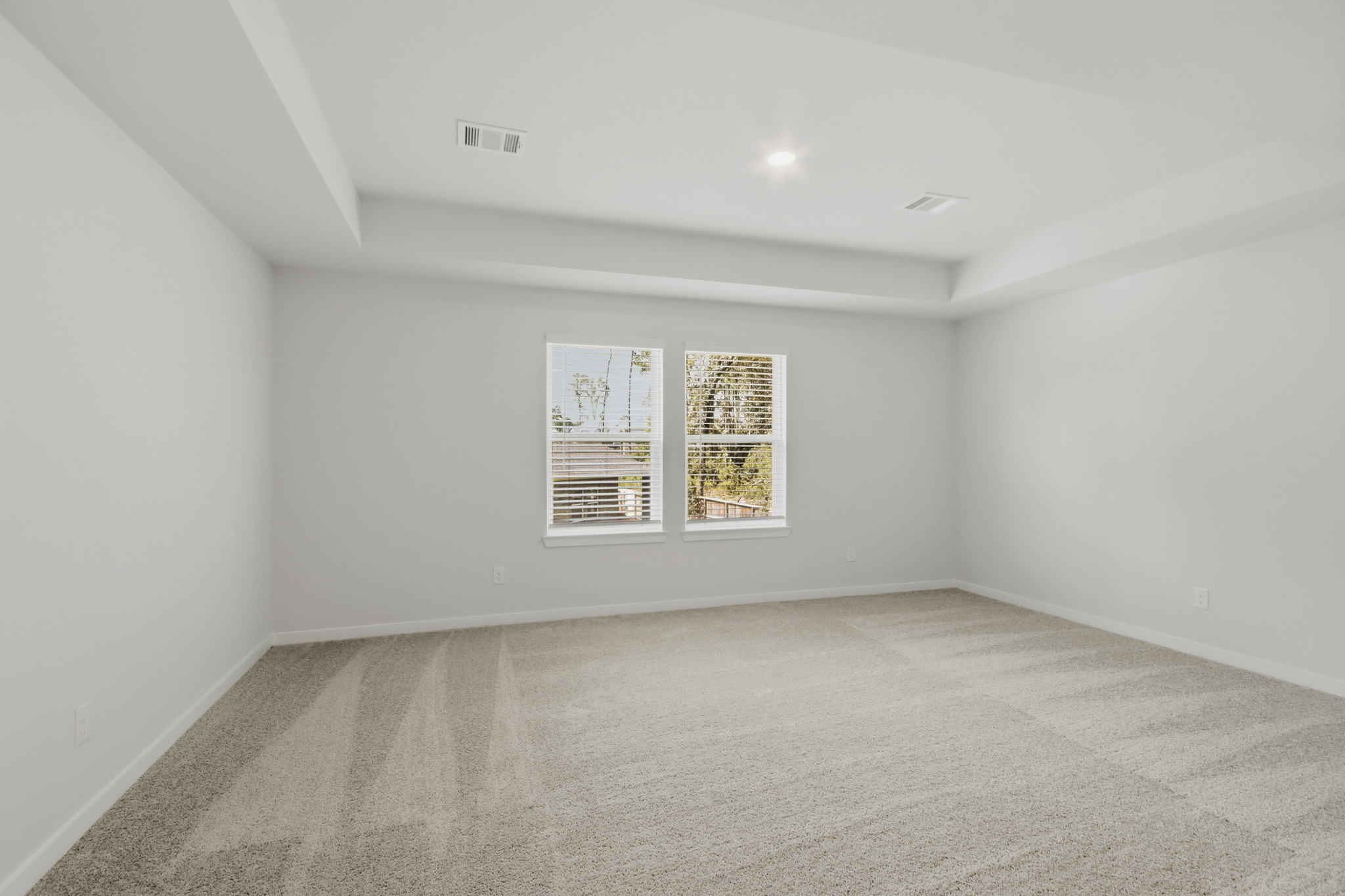 A room with a poster on the wall.