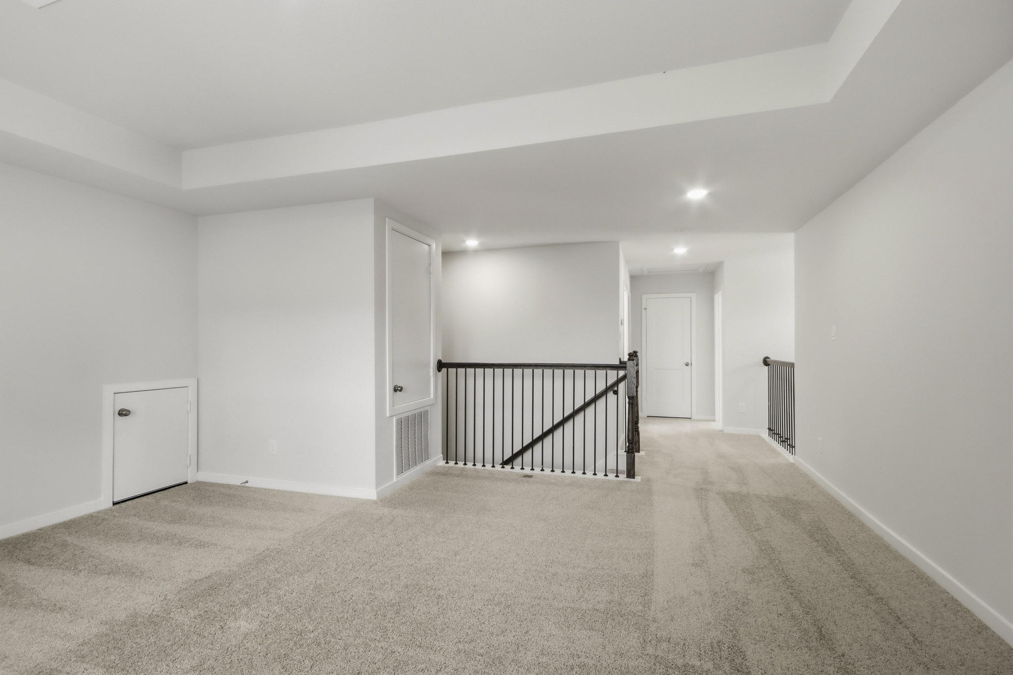 A hallway with white walls.