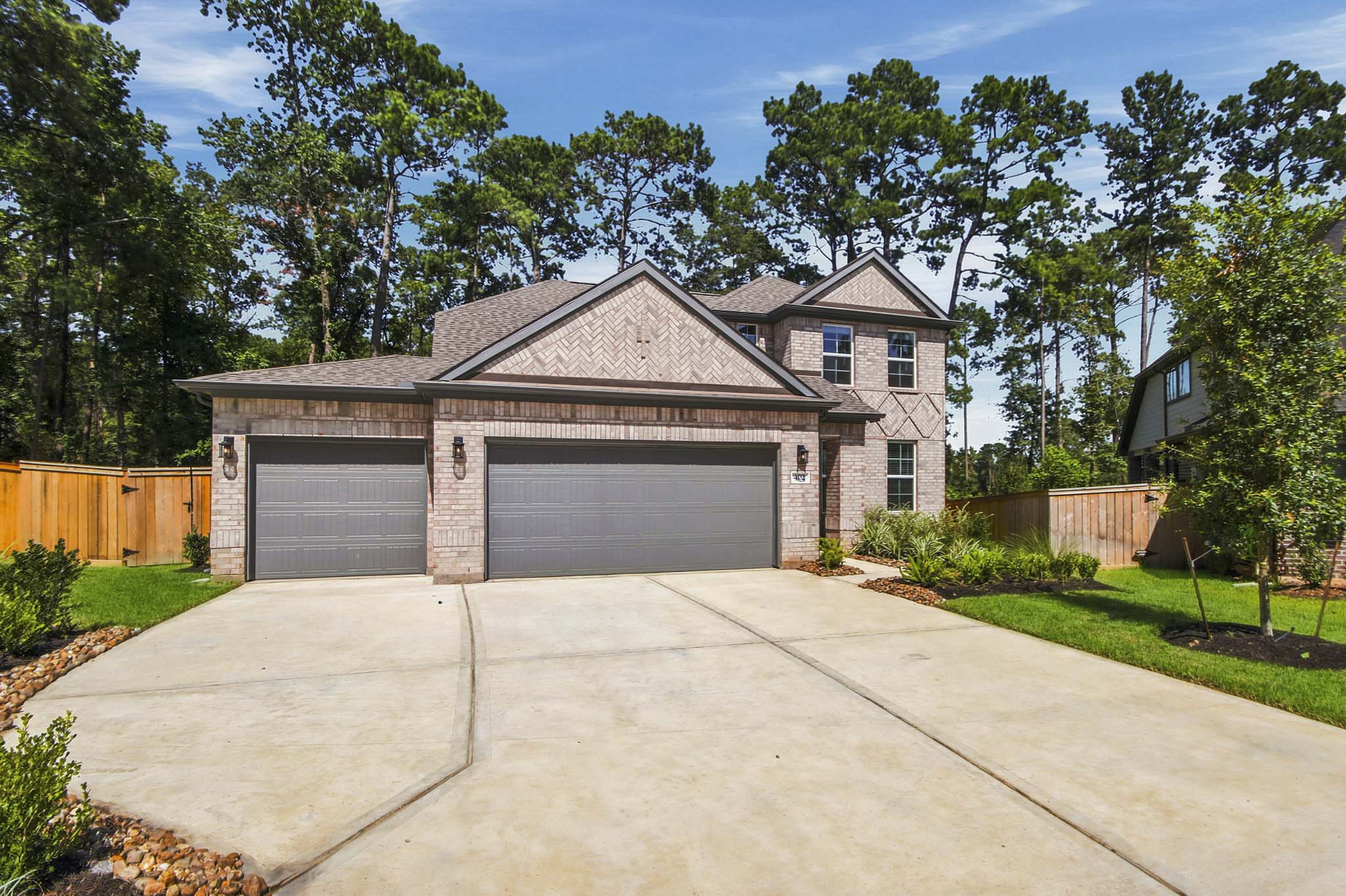 A driveway leading to a house.