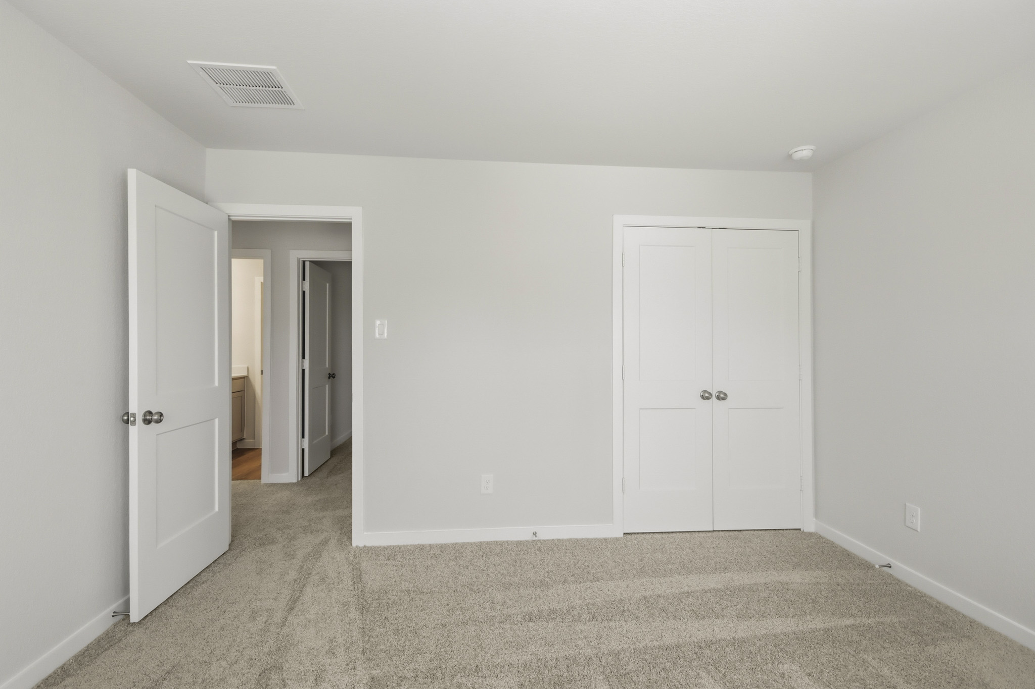 A room with white doors.