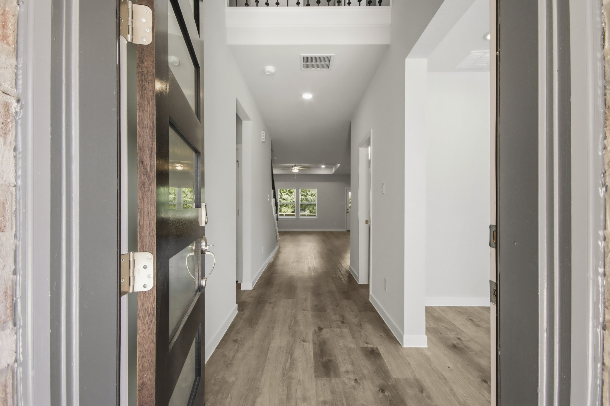 A hallway with white doors.