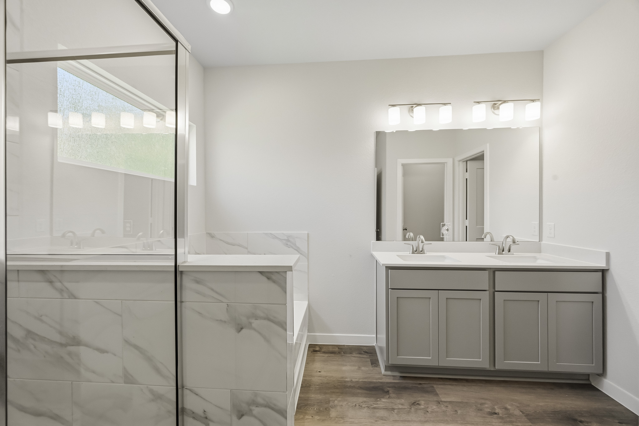 A bathroom with a glass shower.