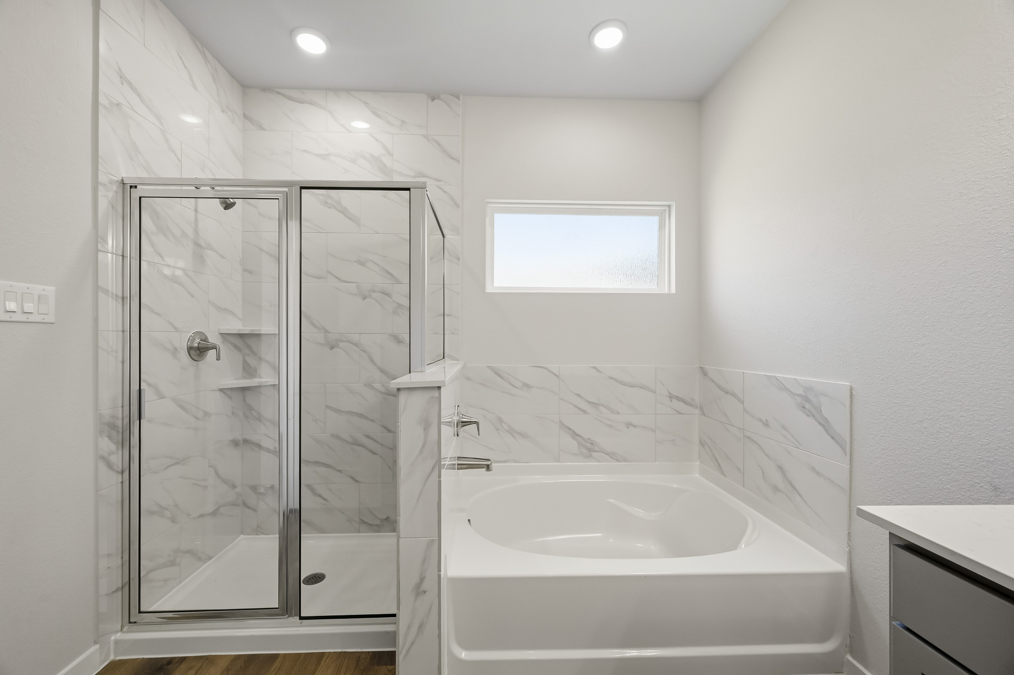 A bathroom with a glass shower.