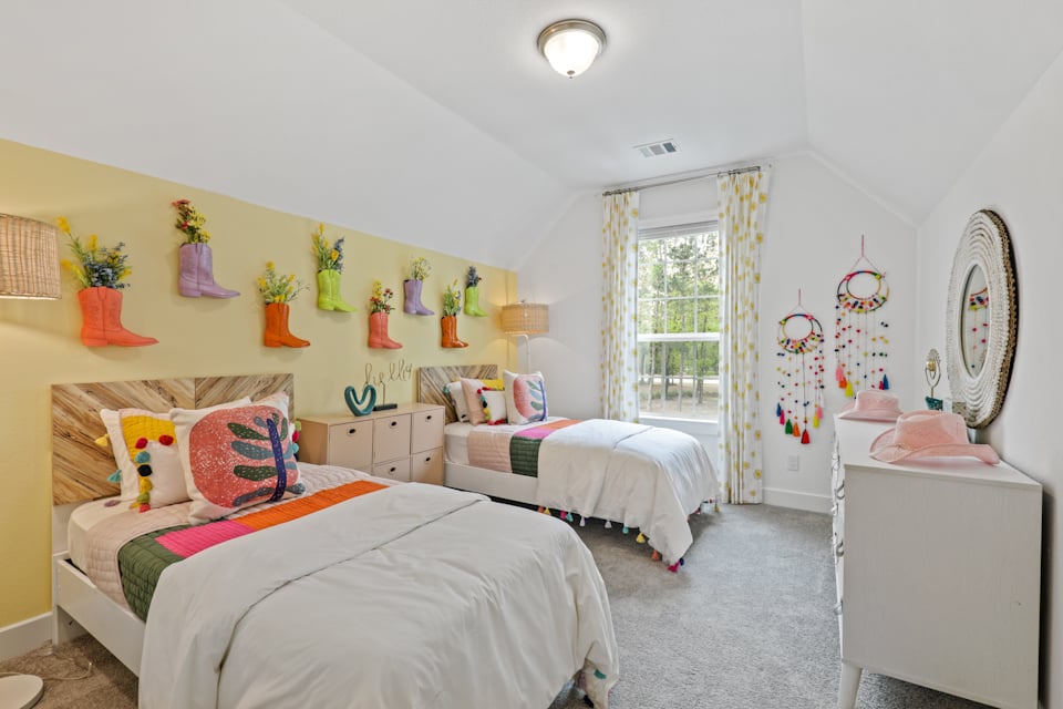 A bedroom with two beds.